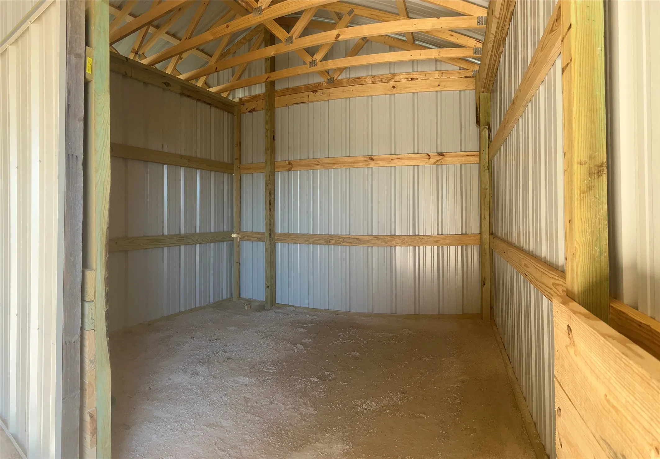 Garage featuring metal wall