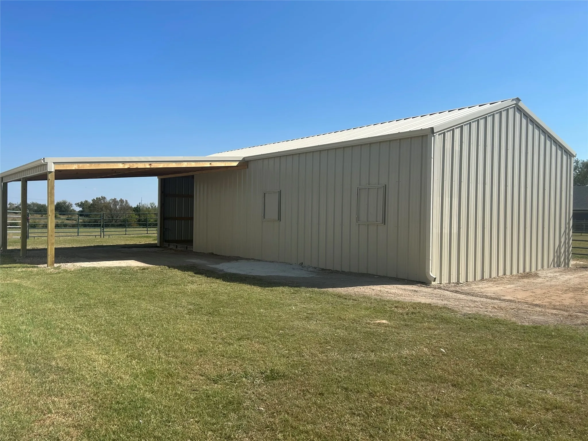 View of pole building featuring a carport