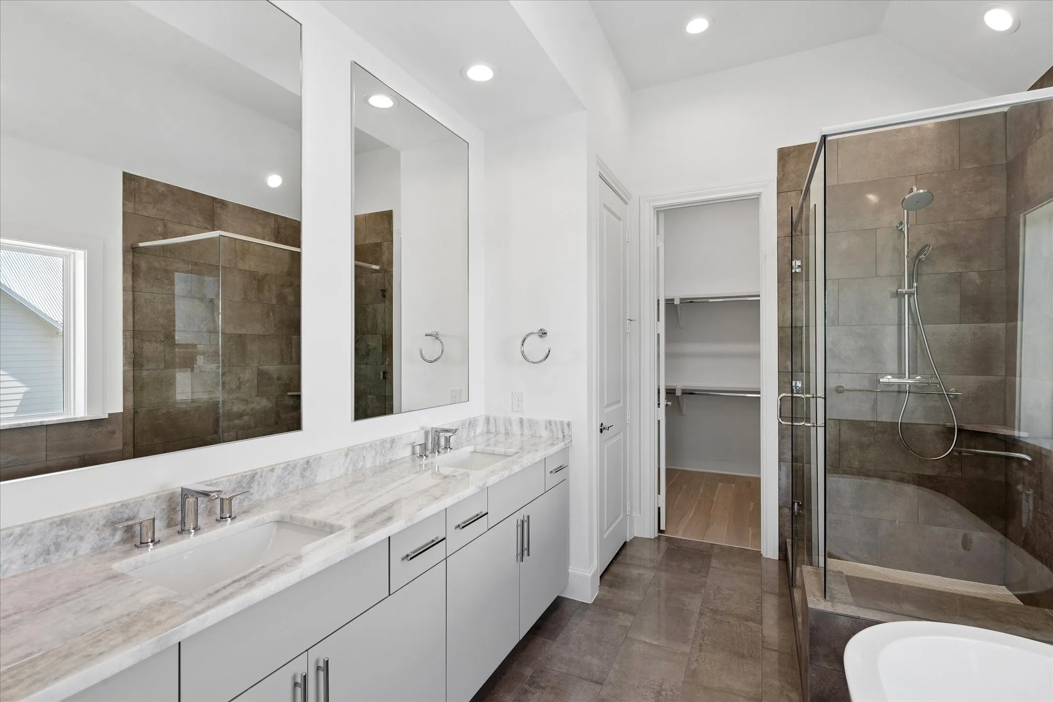 Double vanity with a light-toned countertop, dual rectangular undermount sinks, and brushed nickel fixtures