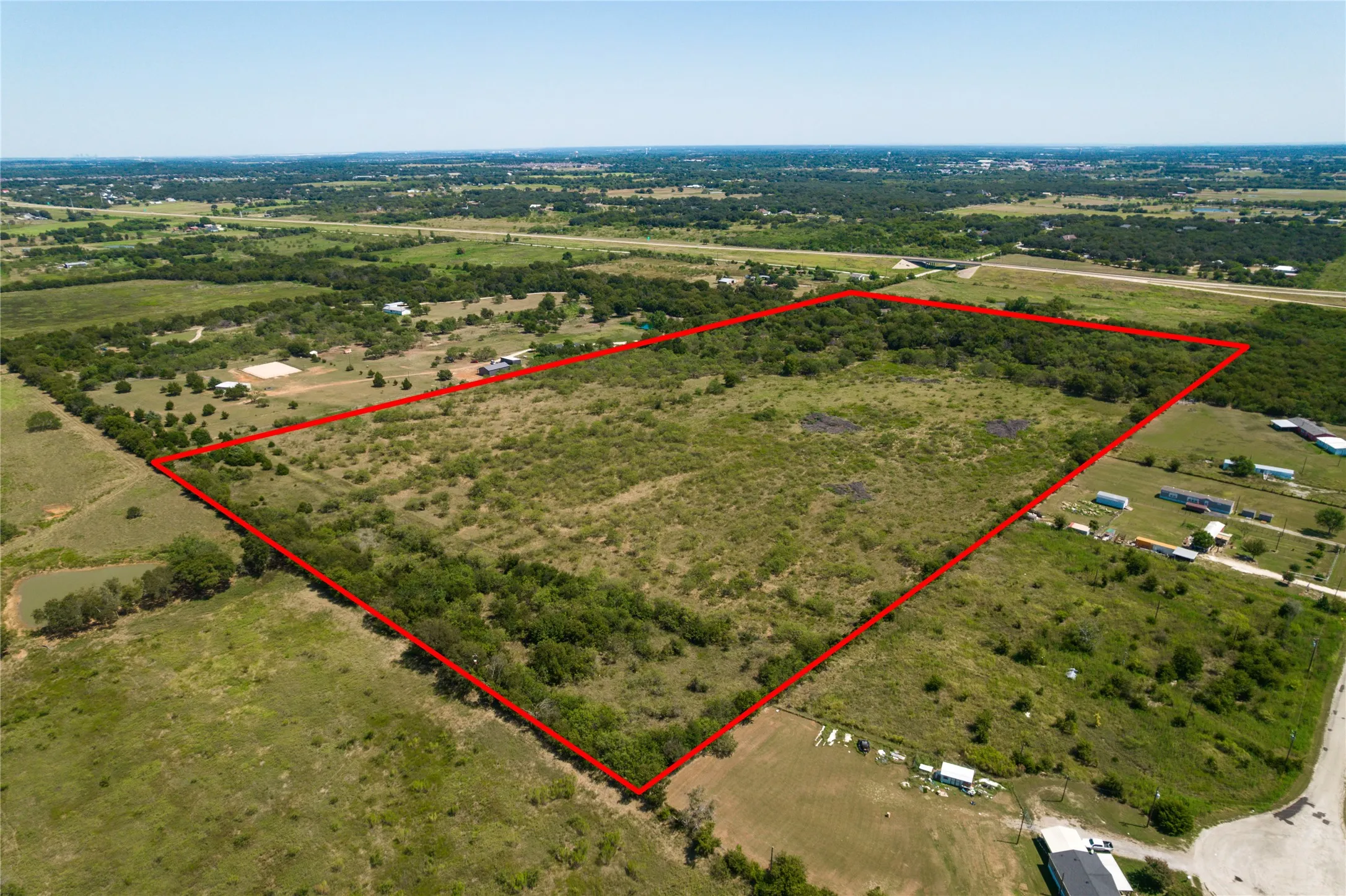 Overview of rural landscape featuring property boundaries highlighted