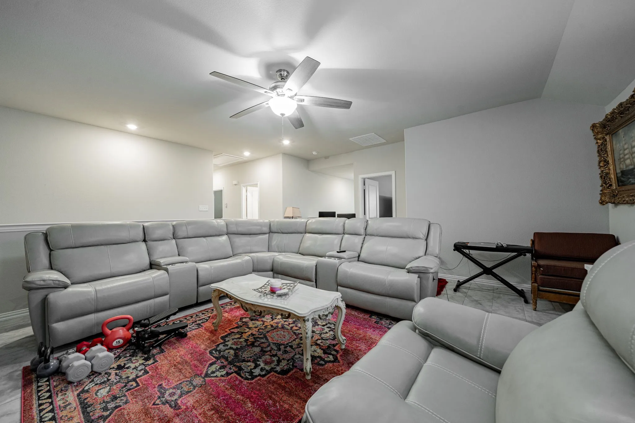 Living area with ceiling fan, recessed lighting, and vaulted ceiling