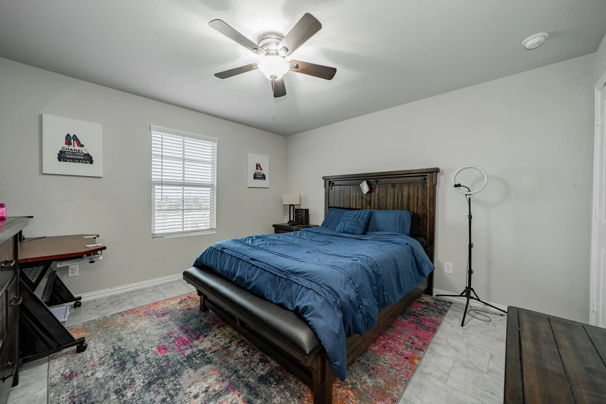 Bedroom with a ceiling fan and baseboards