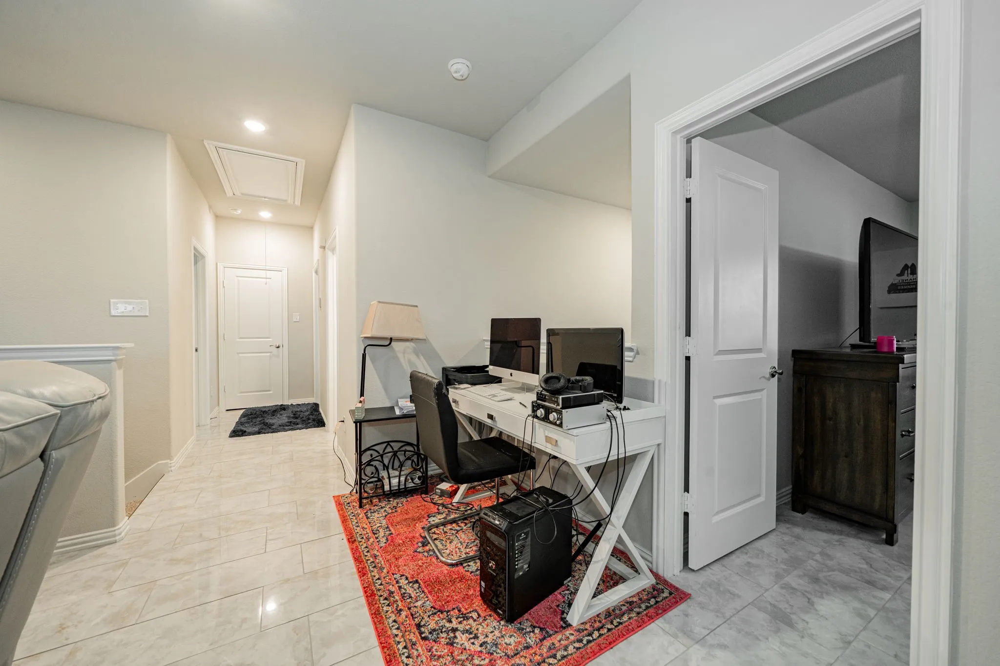 Home office featuring attic access, recessed lighting, and light tile patterned floors