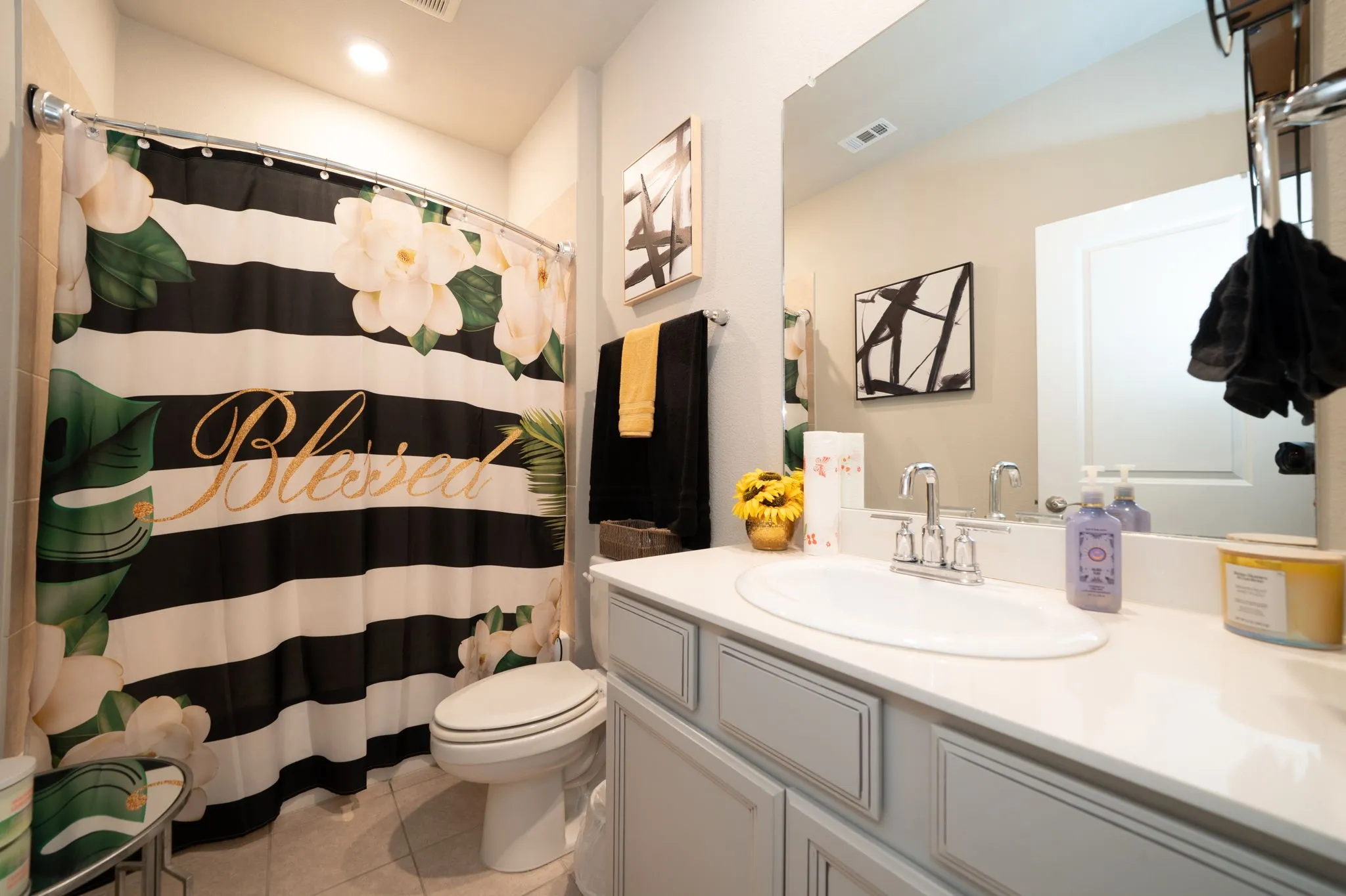 Full bath featuring vanity and light tile patterned floors