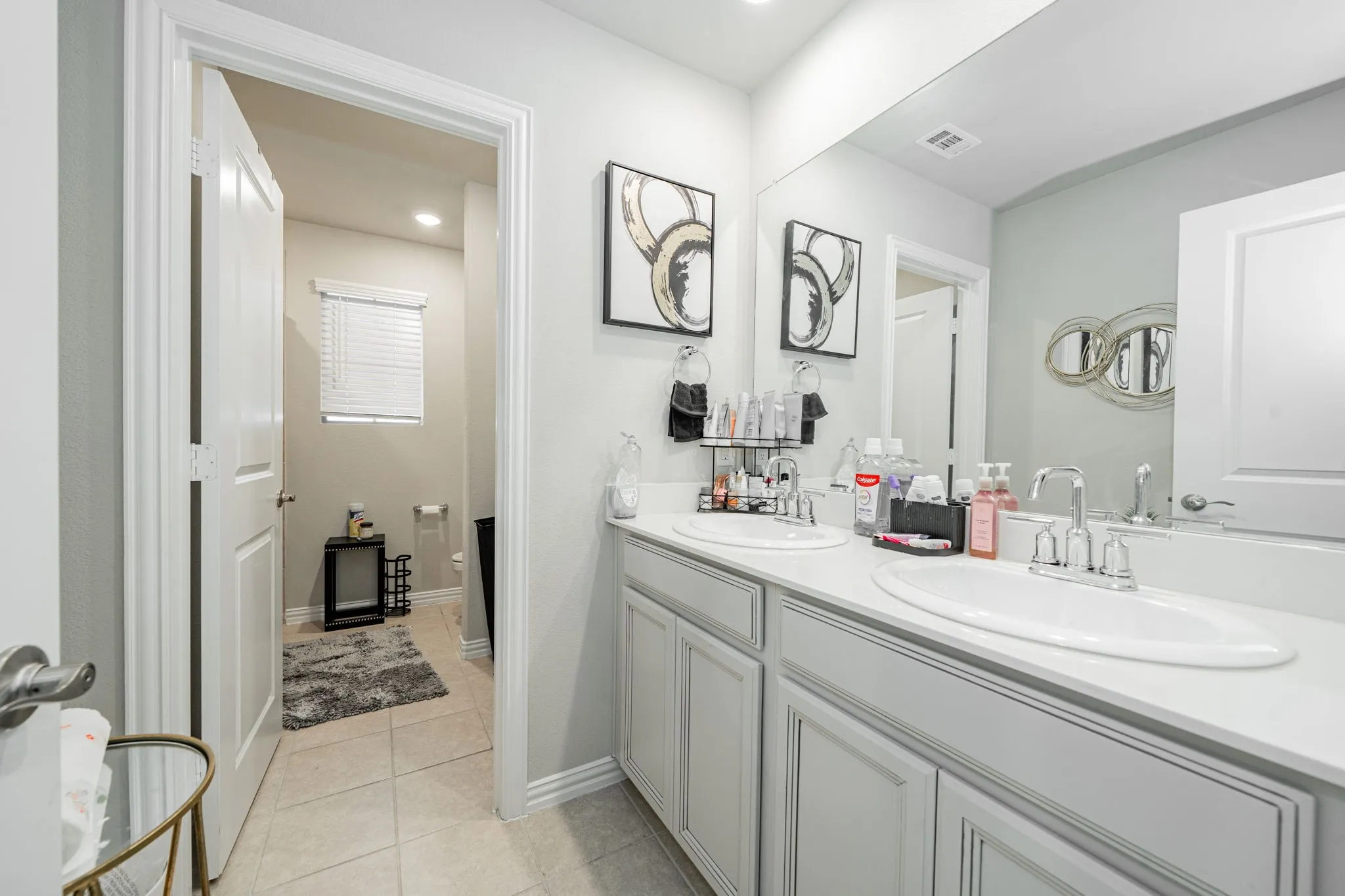 Full bathroom with light tile patterned flooring, double vanity, and recessed lighting