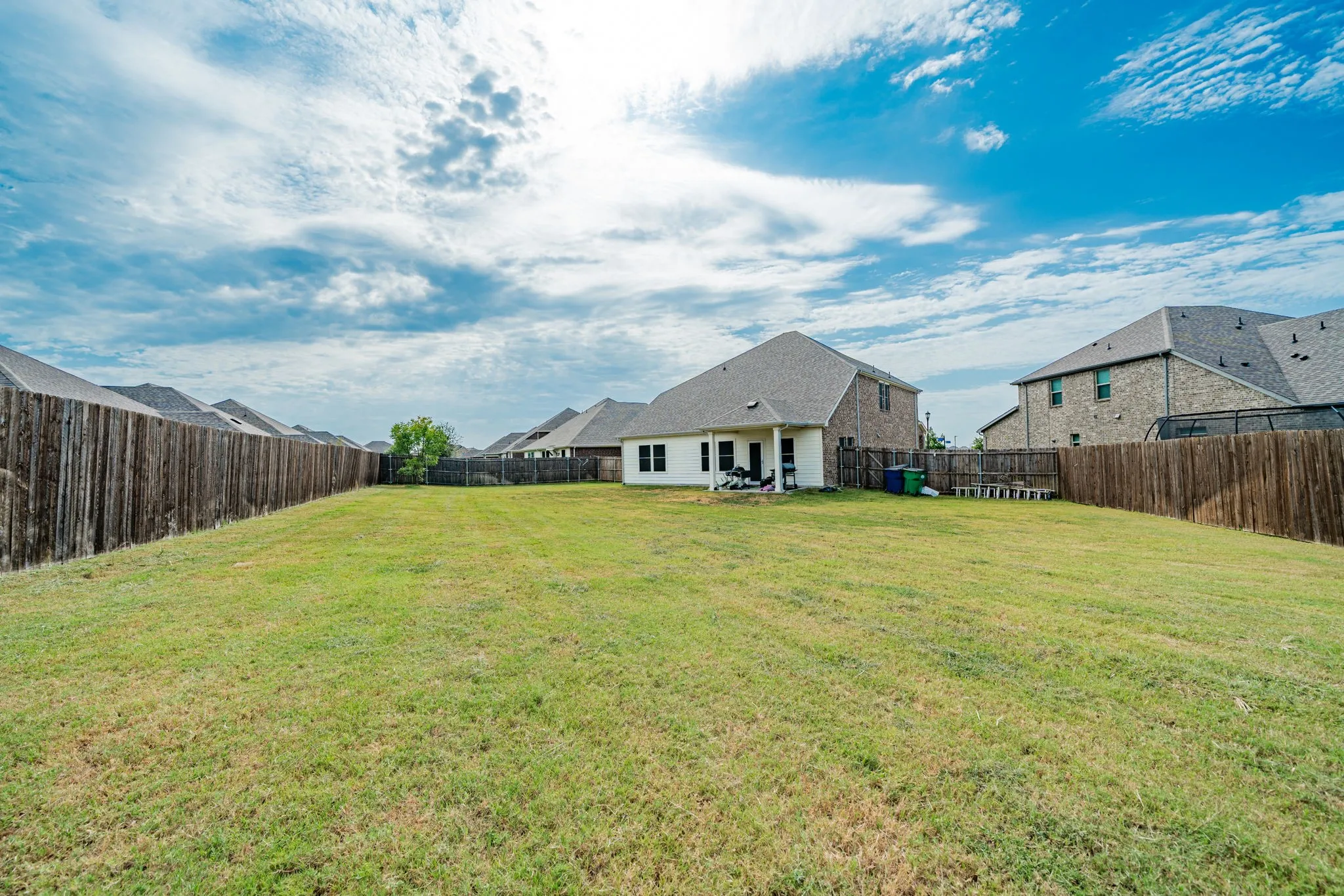 Back of house featuring a patio area and a fenced backyard