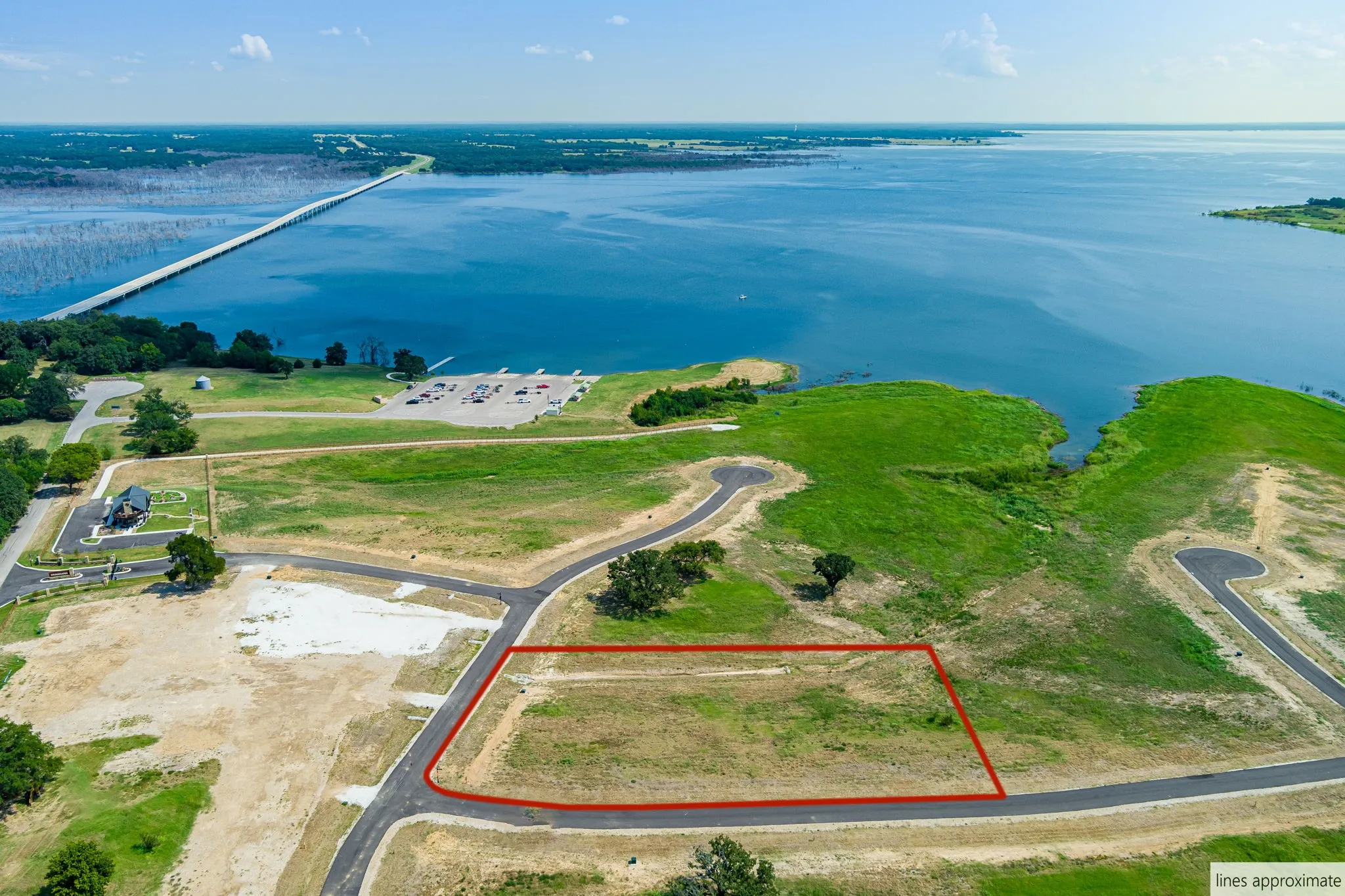 Aerial view of property's location featuring a nearby body of water and property boundaries highlighted
