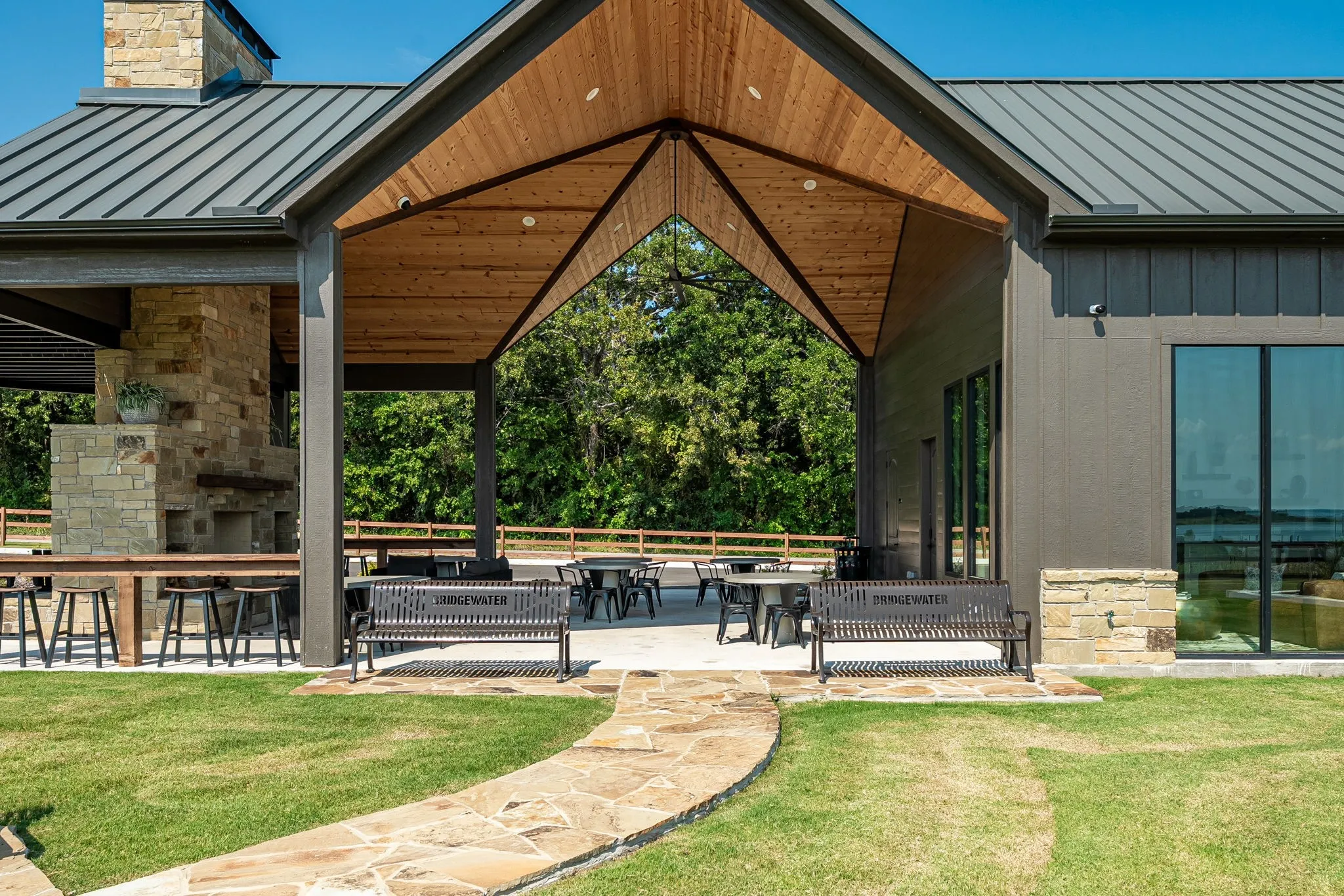Surrounding community featuring a patio area and a lawn at Community Center