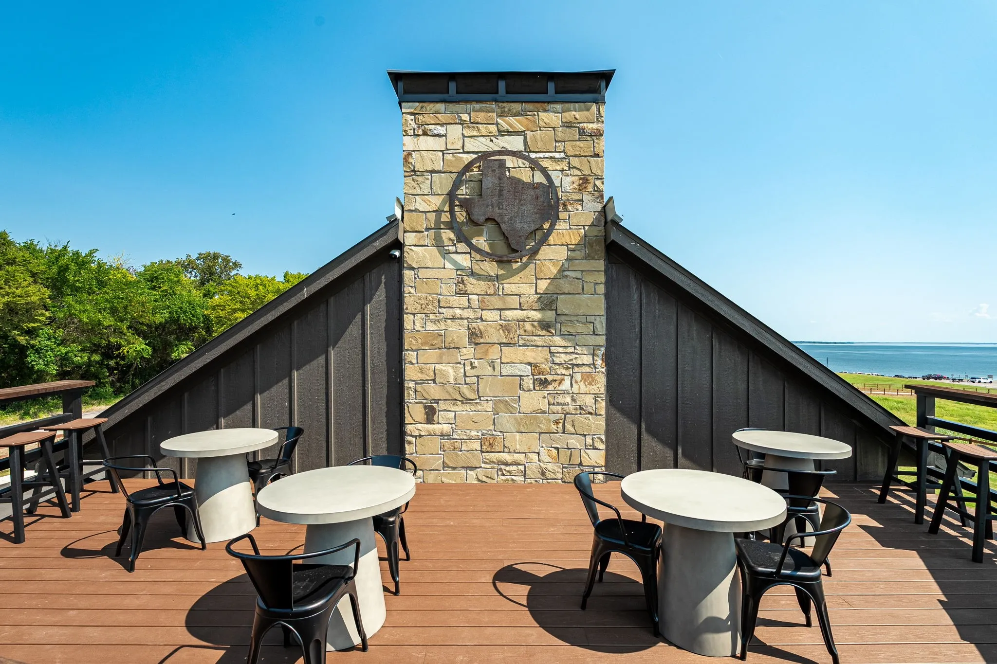 Wooden terrace featuring a water view at Community Center