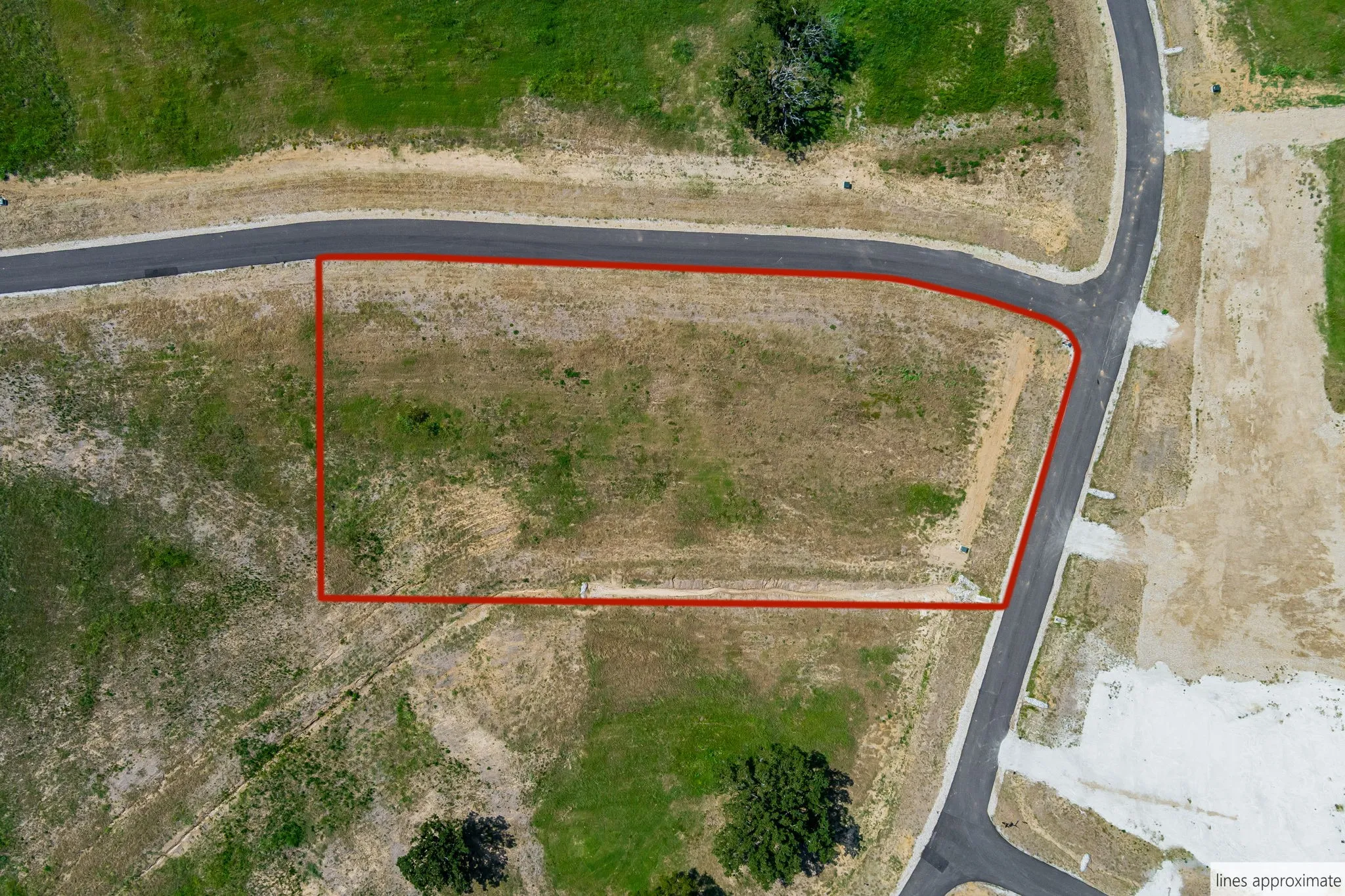 Aerial view of property and surrounding area featuring property parcel outlined