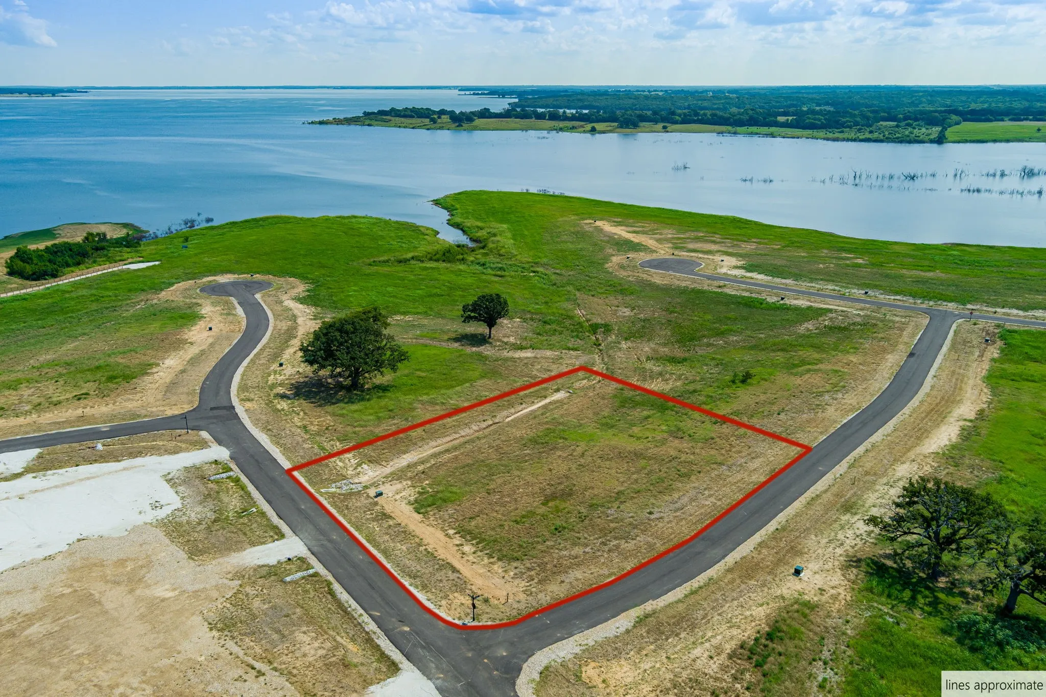 Aerial overview of property's location with a nearby body of water and property parcel outlined