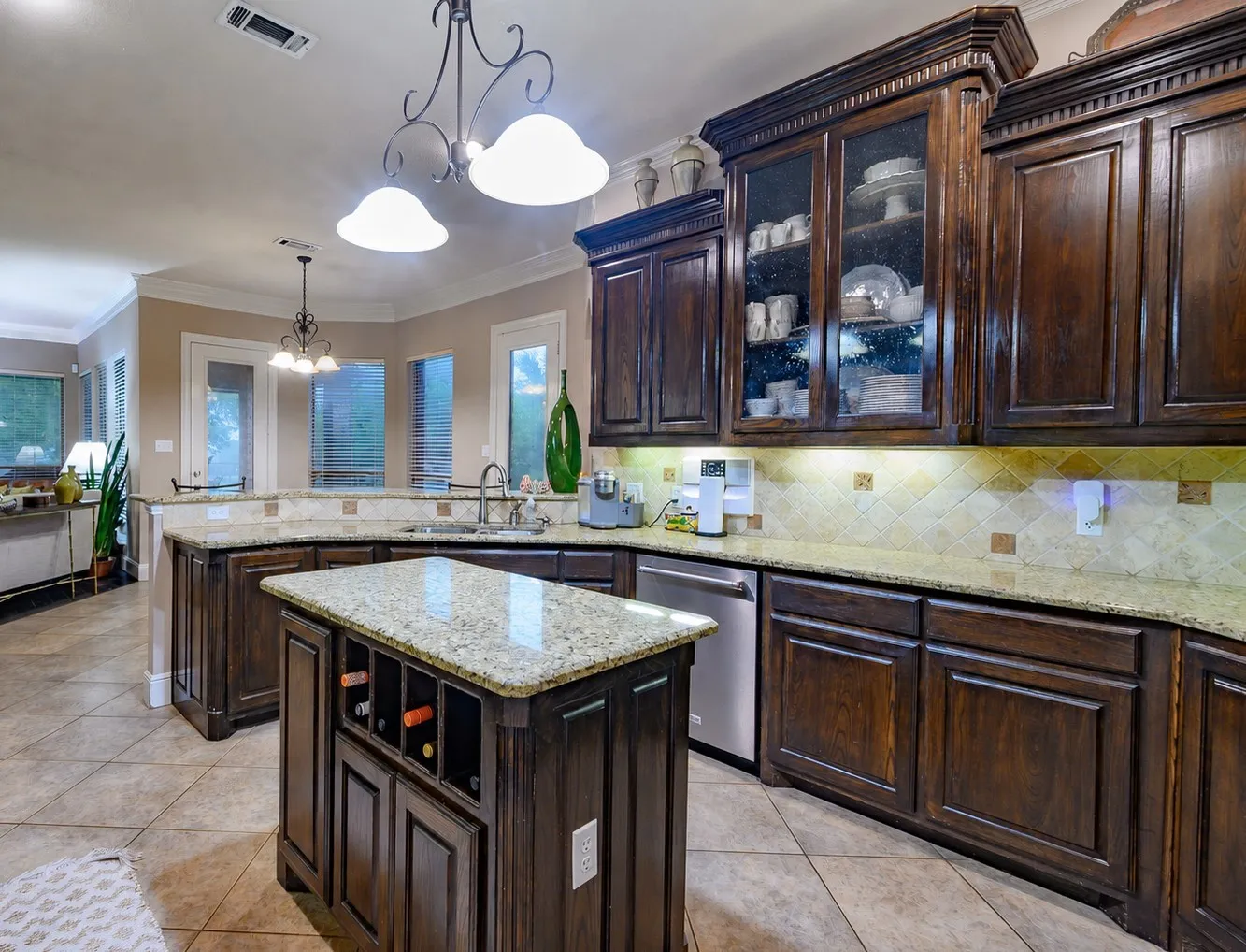 Amazing kitchen with granite countertops, island, gorgeous cabinetry and island.
