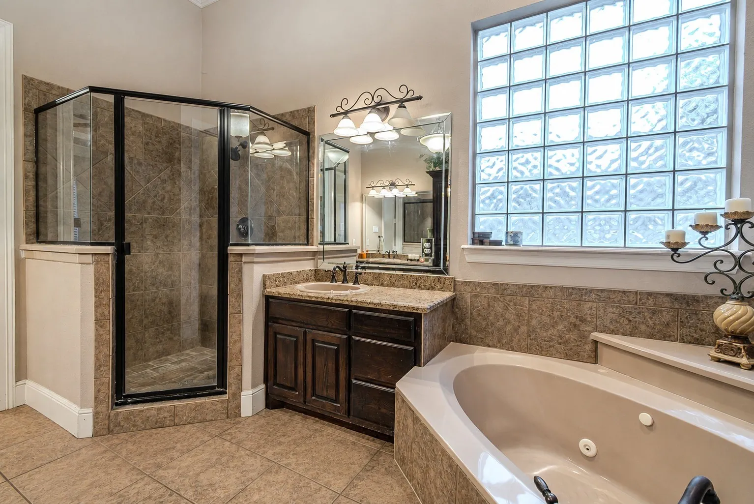 Primary bathroom featuring the large soaking, jetted tub!