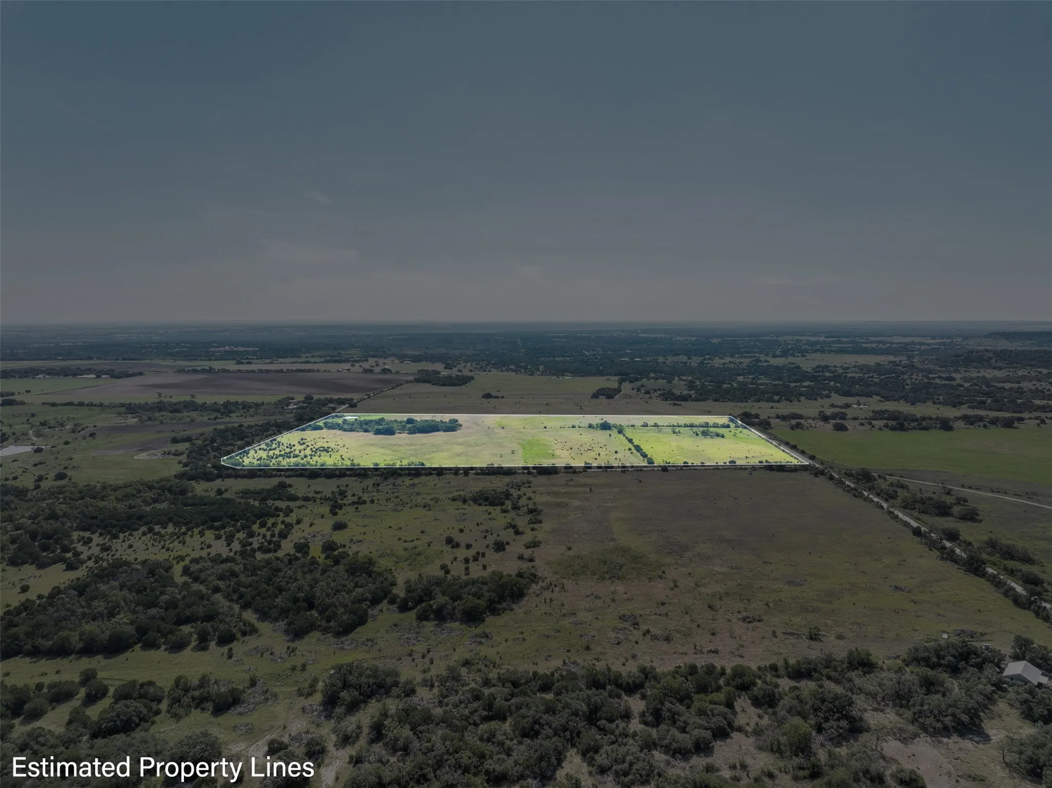 Overview of rural landscape with property parcel outlined