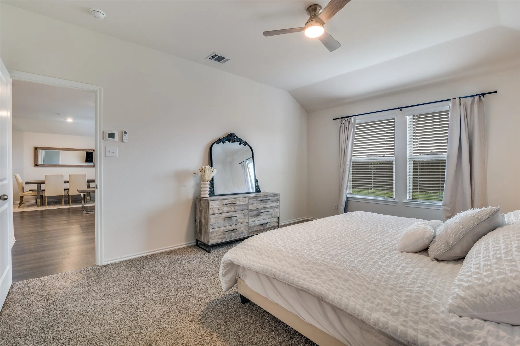 Primary, wonderful windows to back yard.