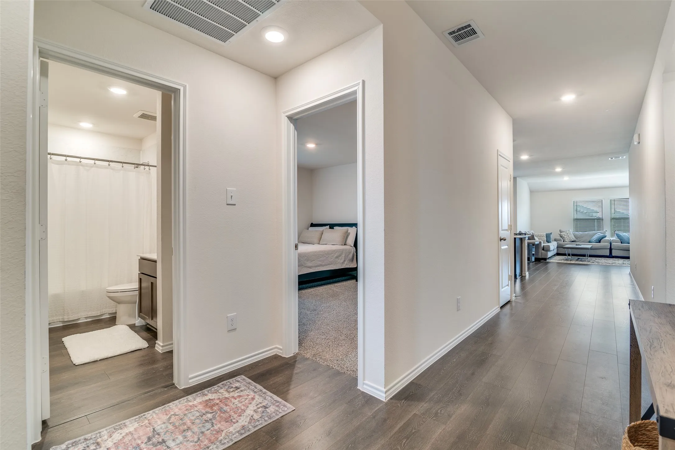 Entry from front door.  2 bedrooms on left, living ahead.