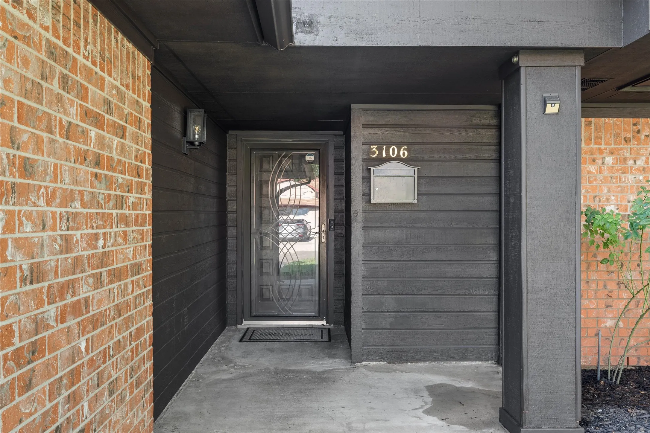 Property entrance with brick siding