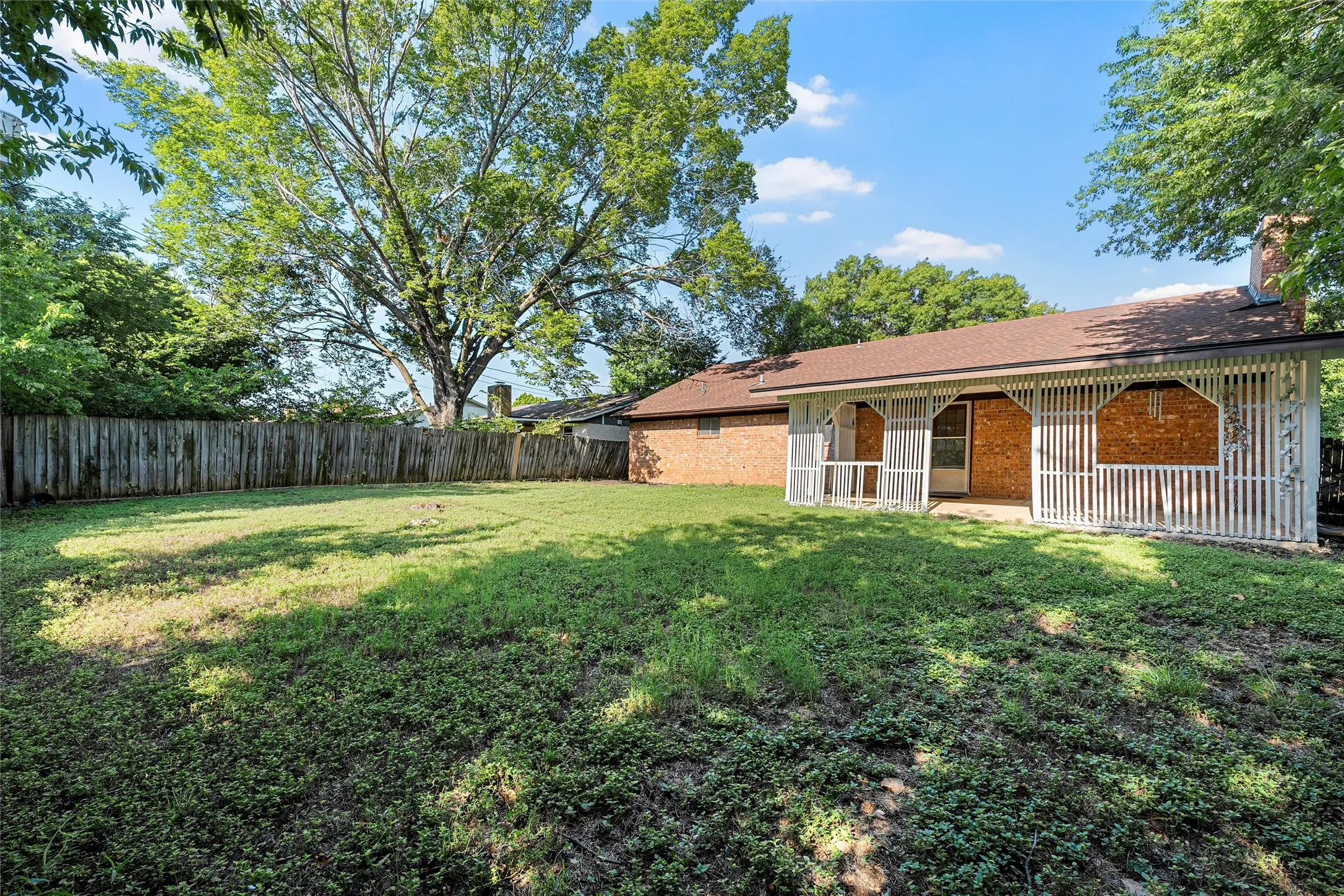 View of fenced backyard