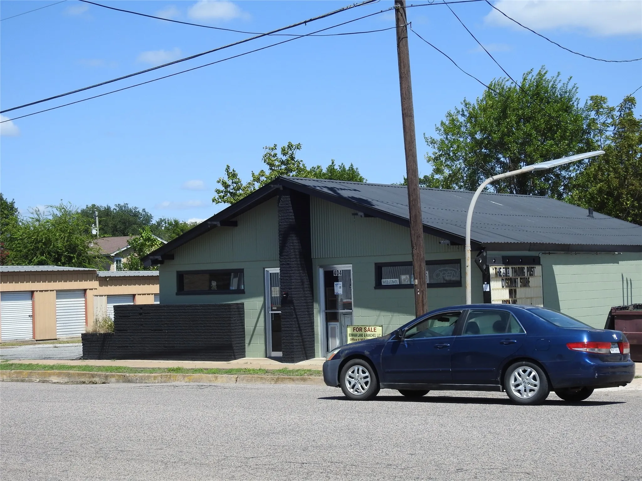 Close up view of street and building entrance.