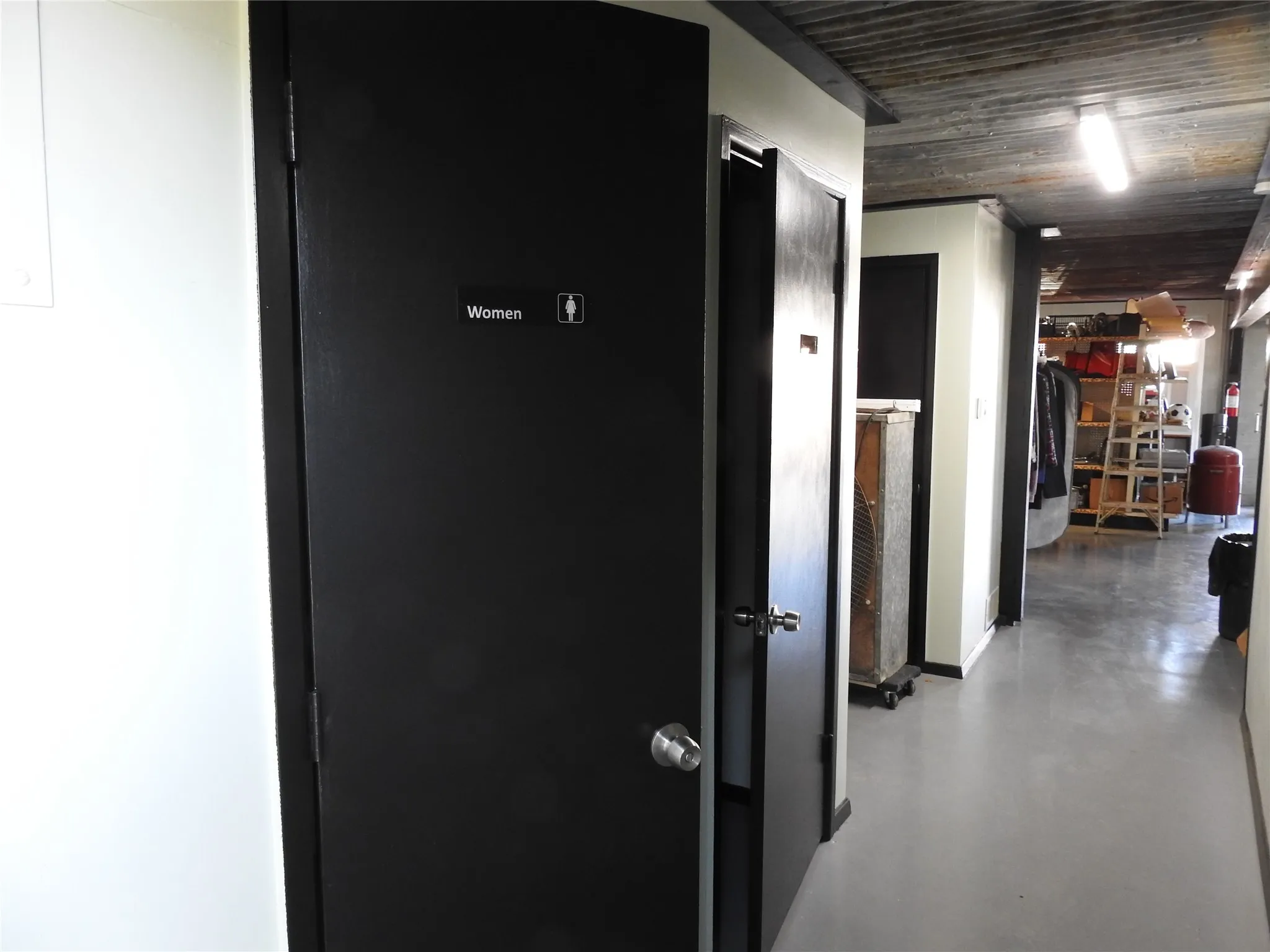 From the back door entrance past the men's and women's separate rest rooms.