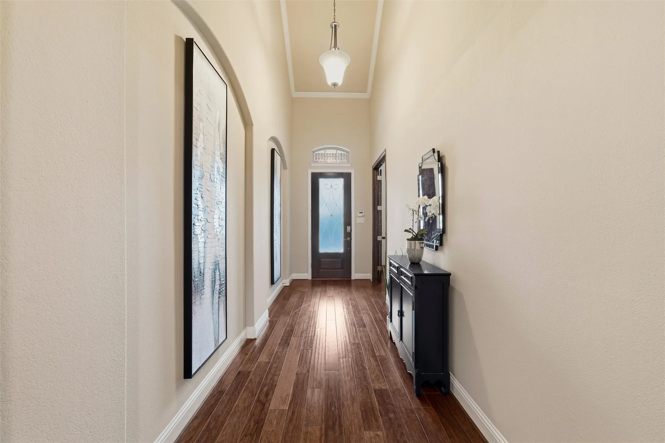 Another view of your main entrance. Featuring art niches and provides plenty of room to greet your family and friends.