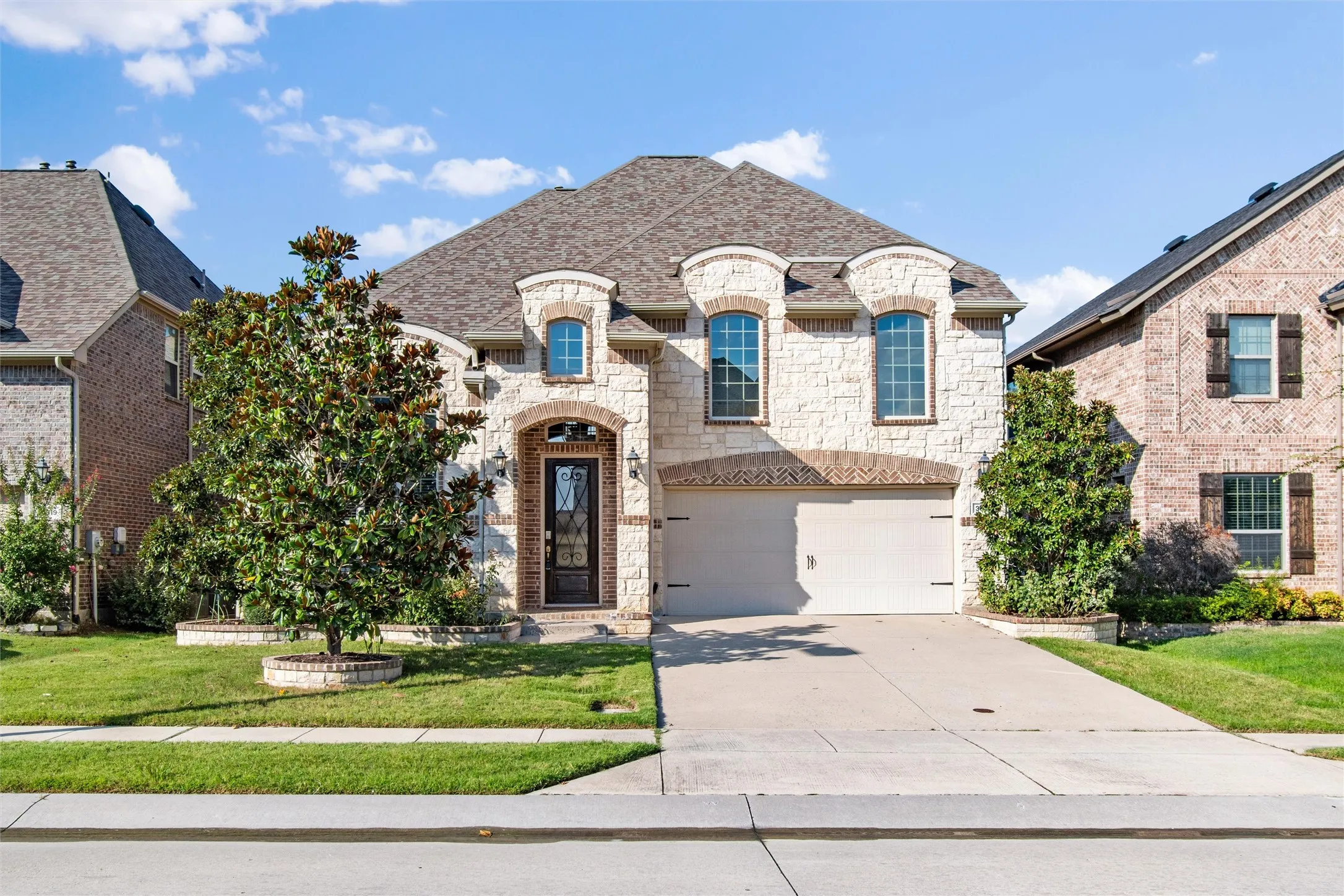Welcome Home! French provincial home with stone and brick elevation in the heart of Irving