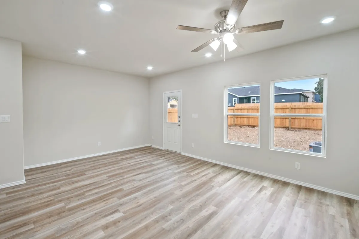 Empty room with light wood-type flooring, recessed lighting, and ceiling fan