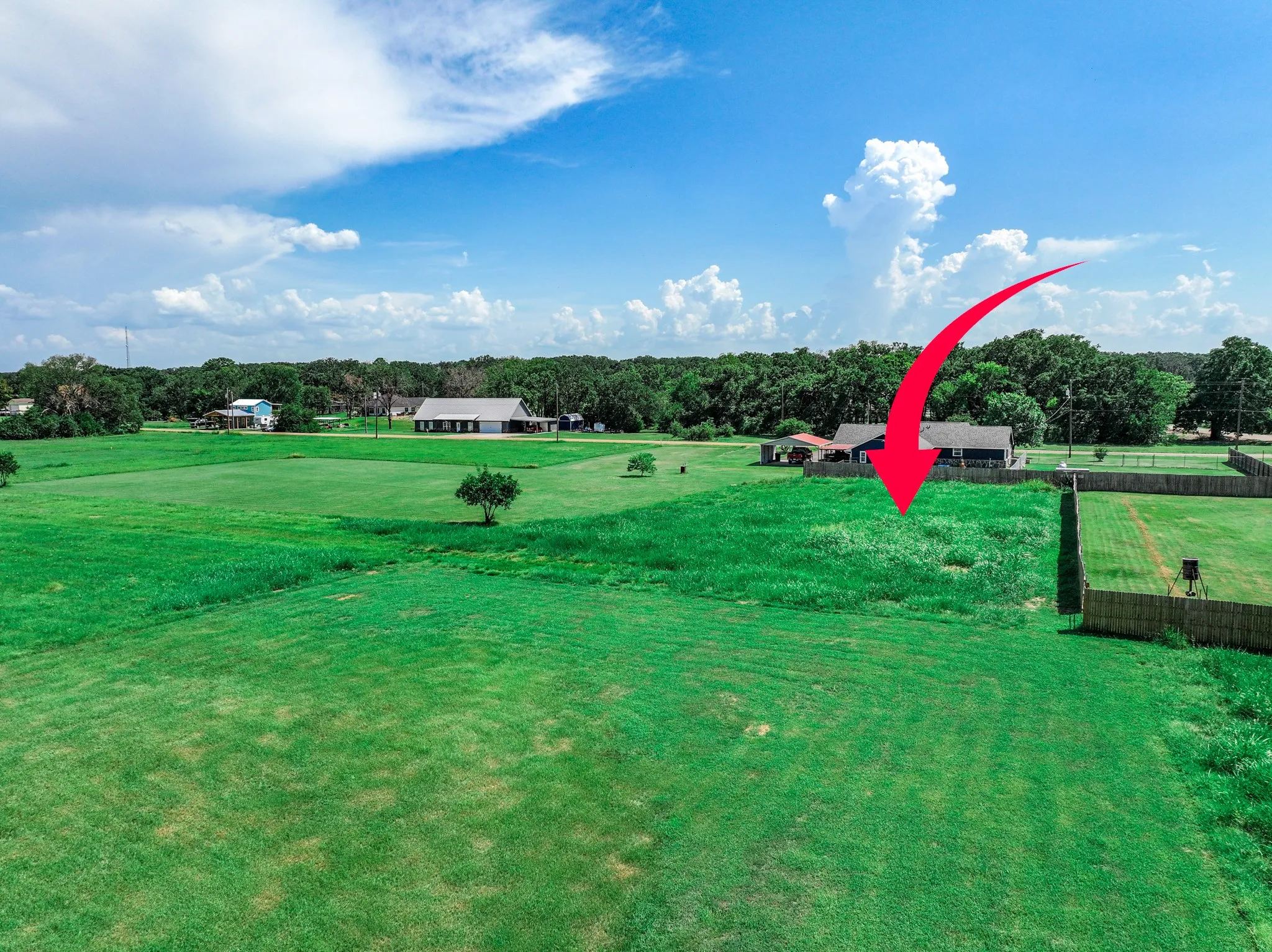 View of property's community with a lawn