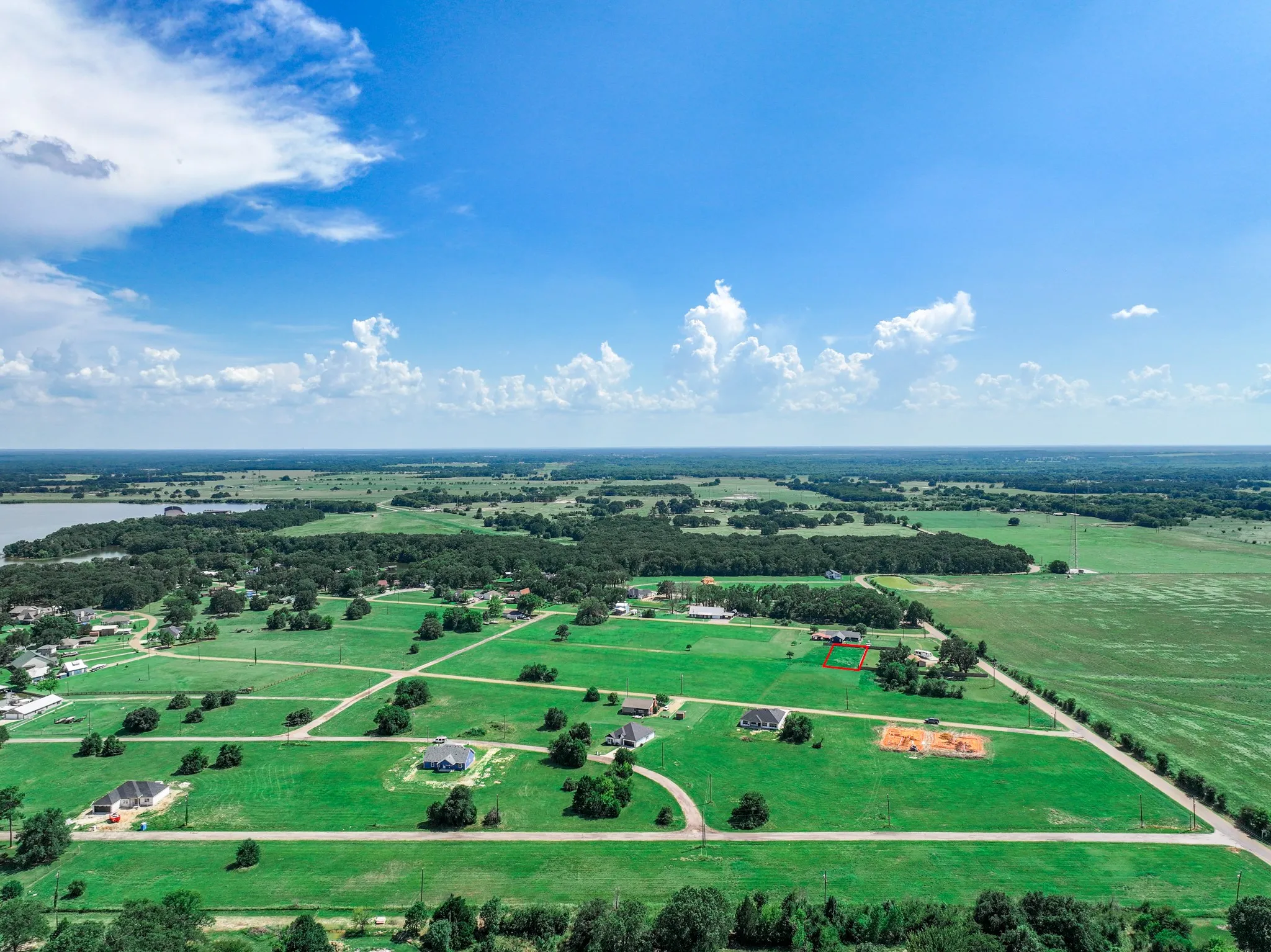Aerial view of sparsely populated area with agricultural land