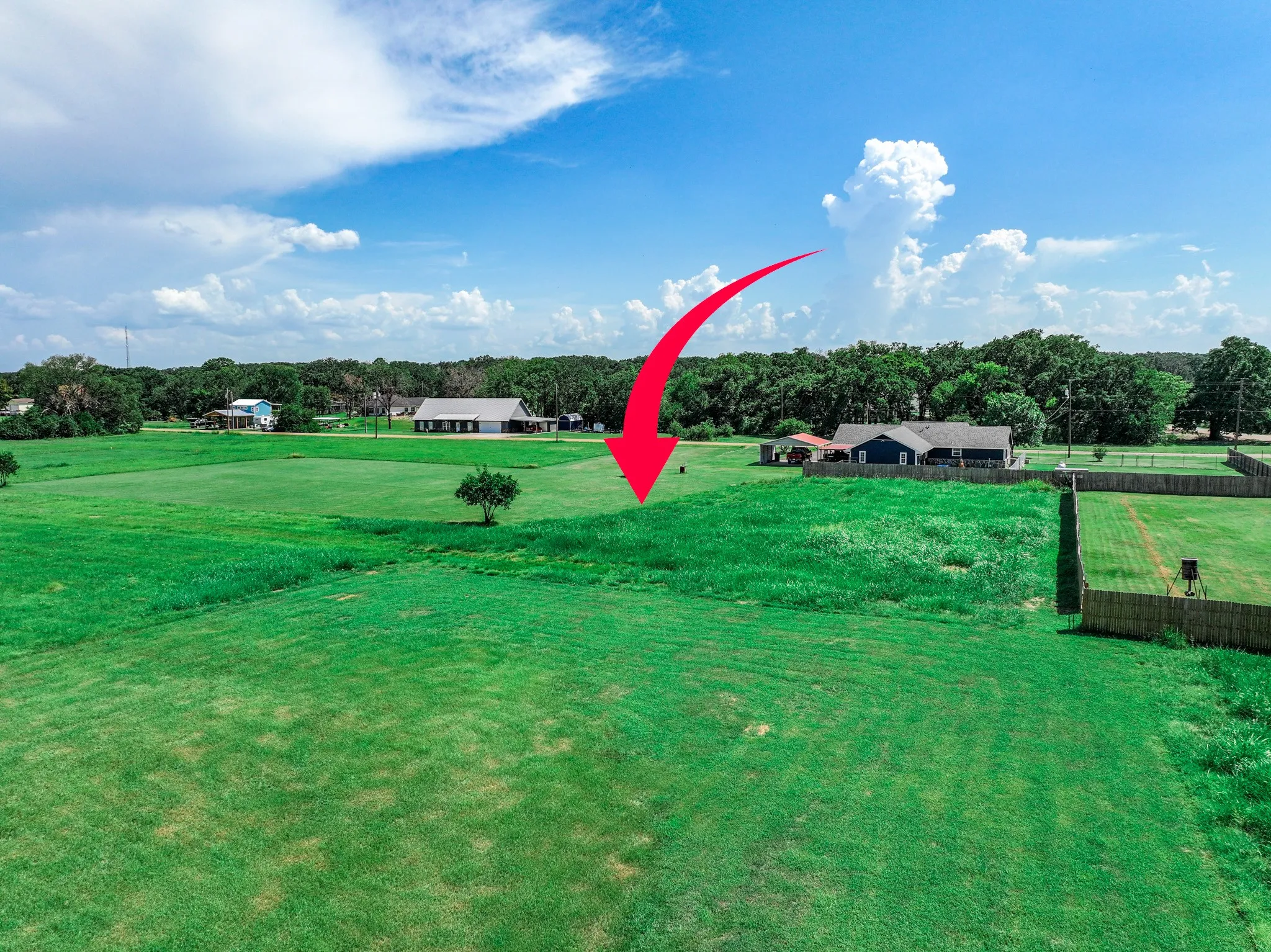 View of community featuring a yard and a view of rural / pastoral area