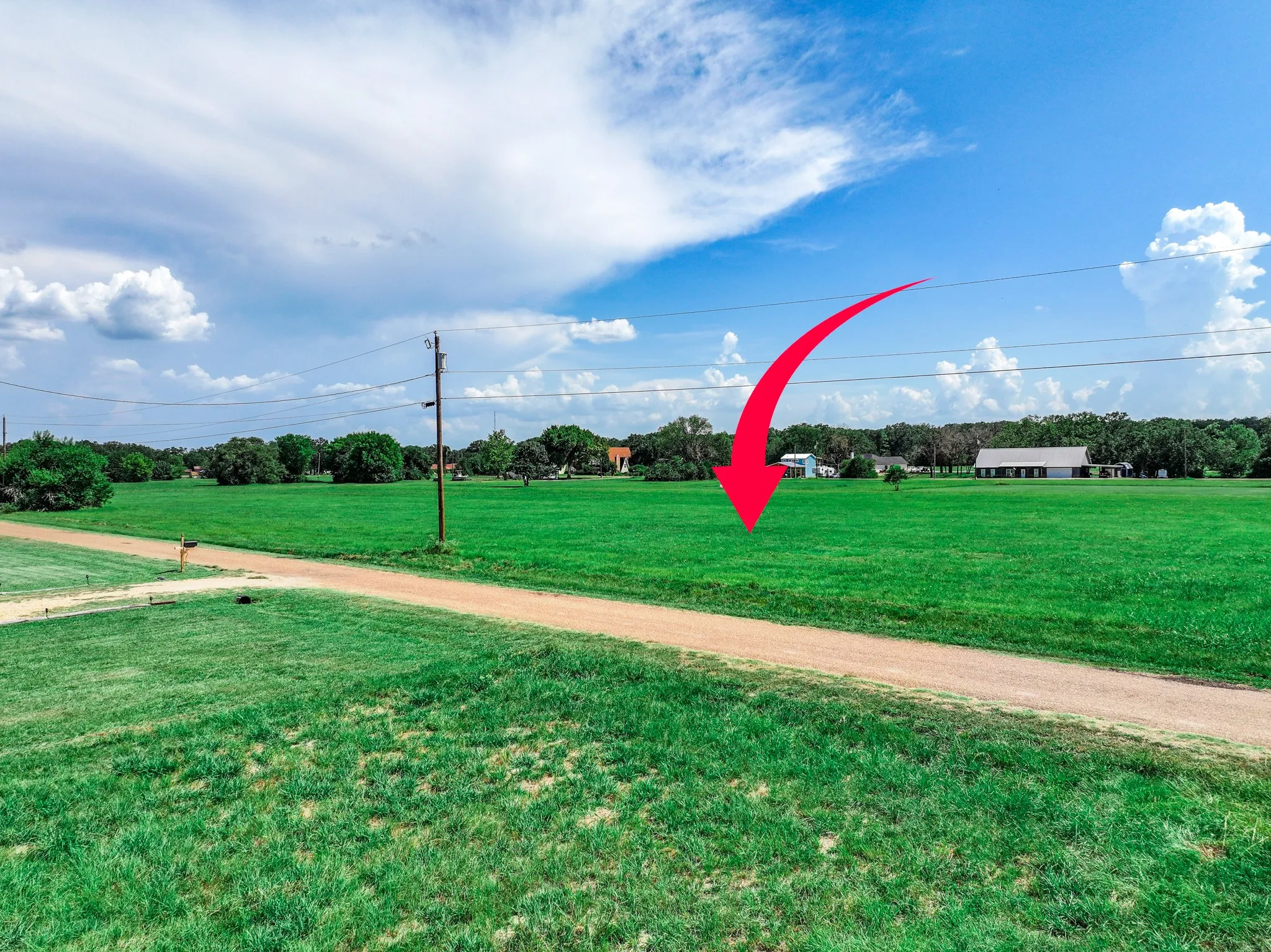 View of home's community with a lawn