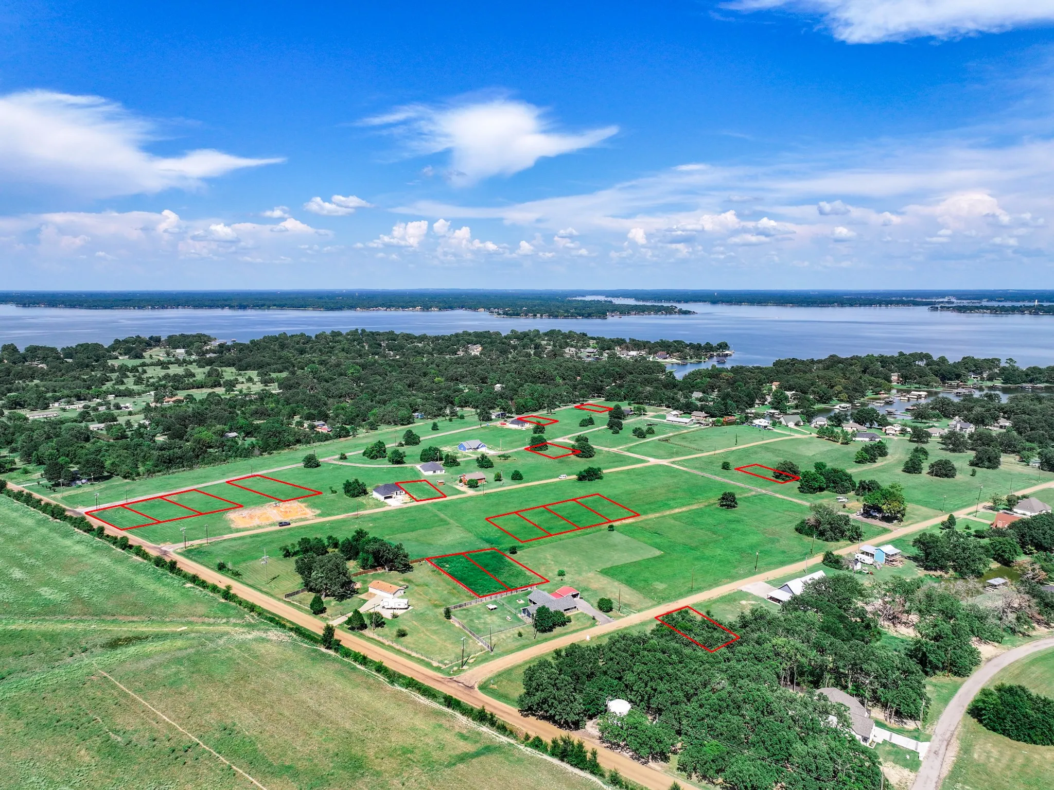 Aerial overview of property's location featuring a large body of water and property boundaries highlighted