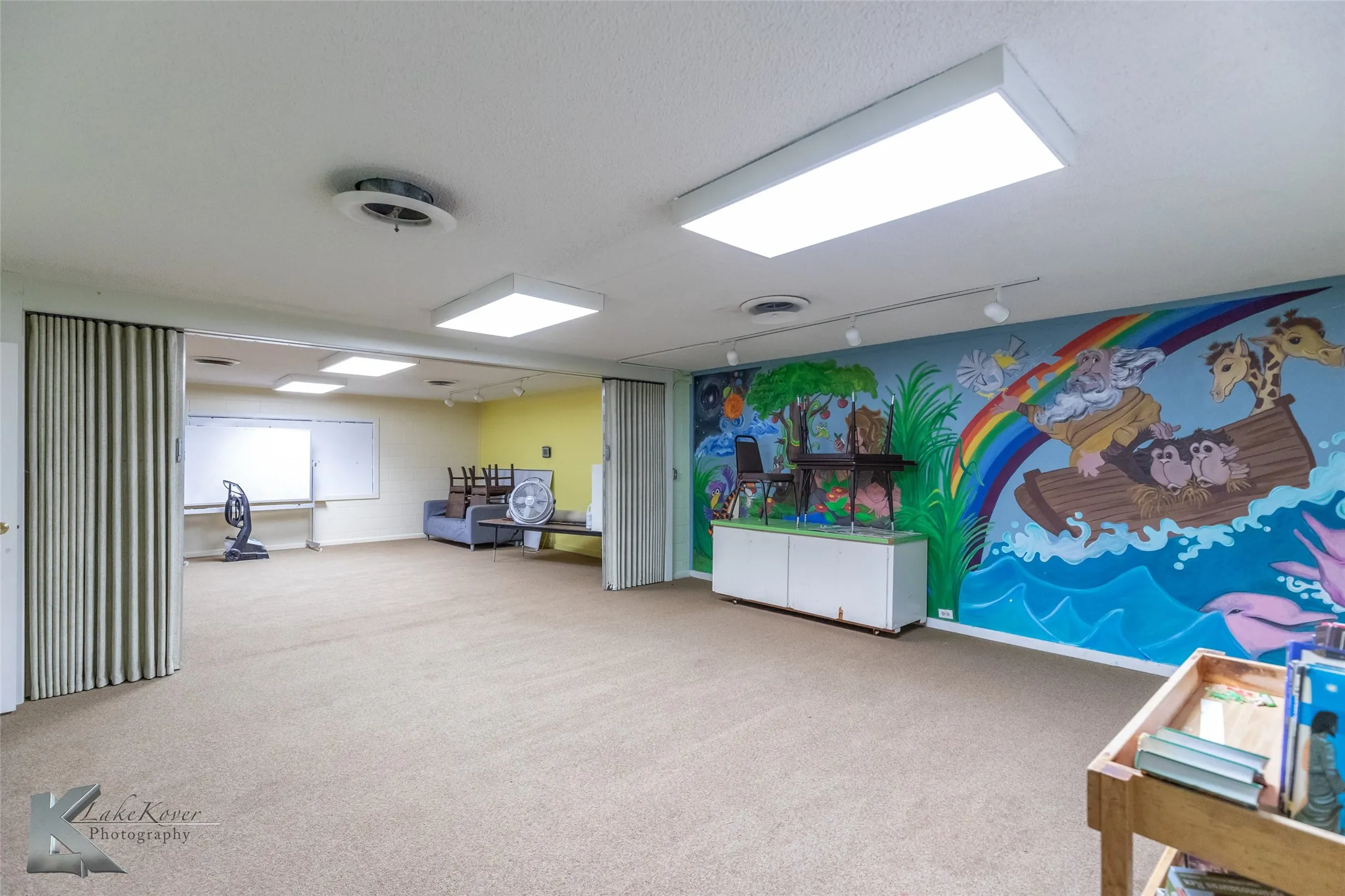 Recreation room with carpet flooring