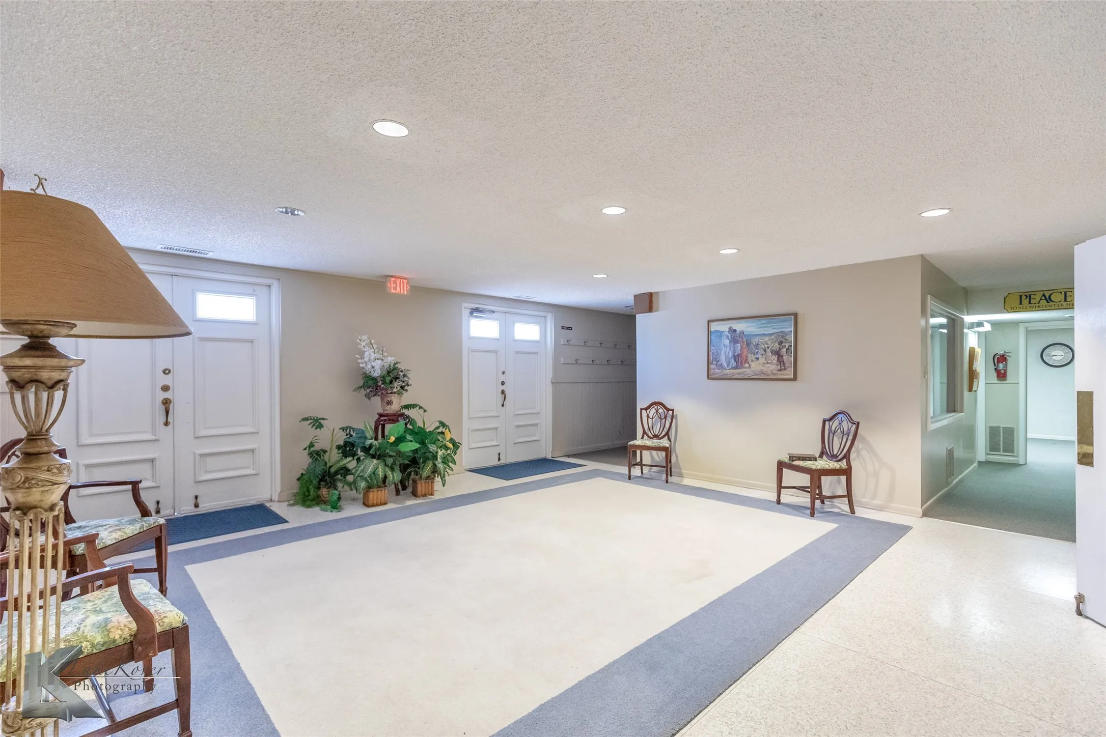 Lobby with a textured ceiling and recessed lighting