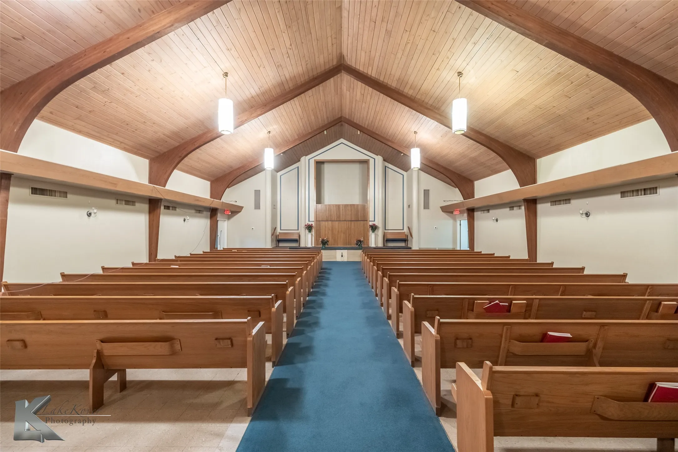 Misc room featuring carpet floors and wooden ceiling