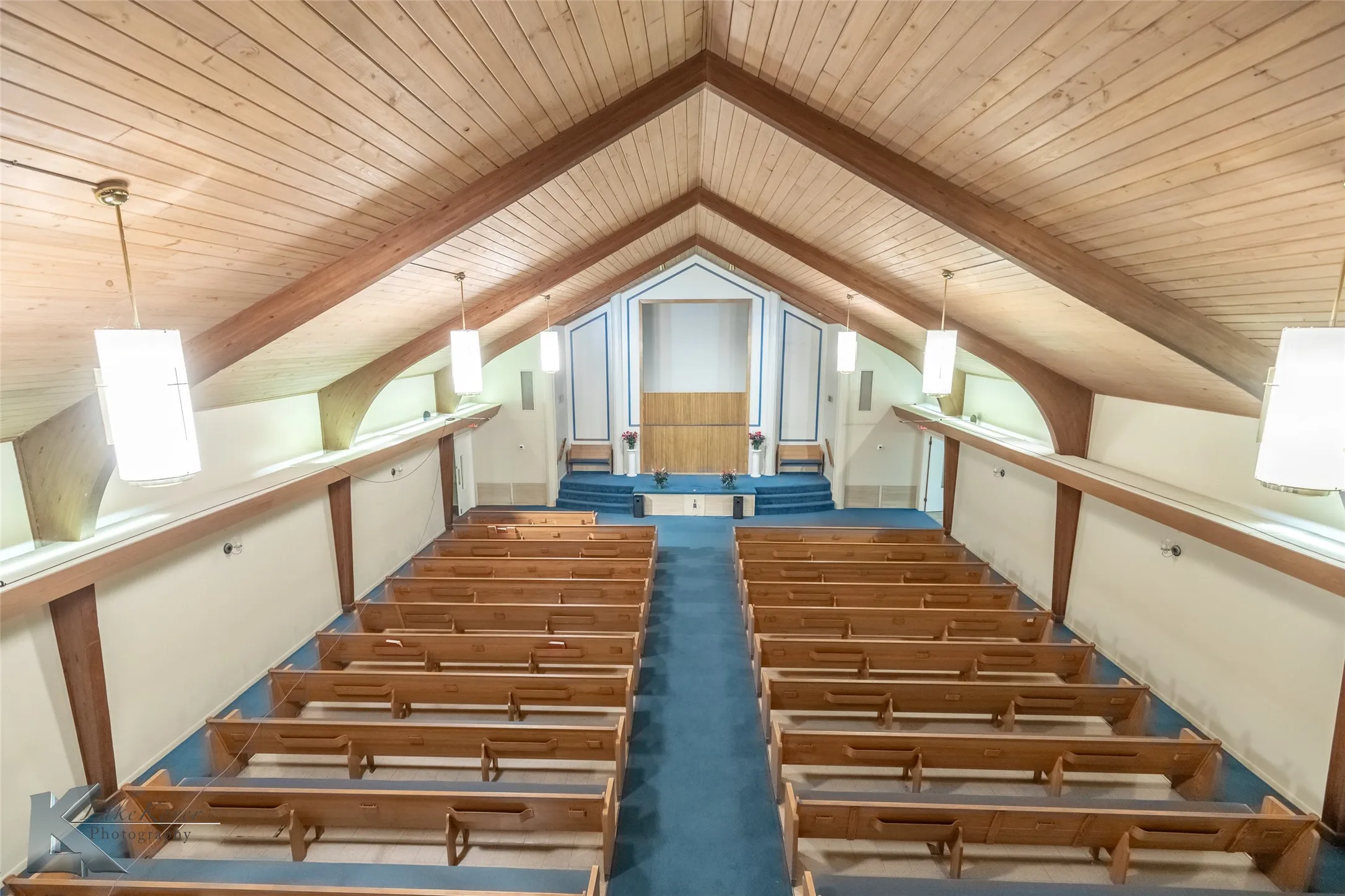 Stairway featuring wood ceiling and carpet
