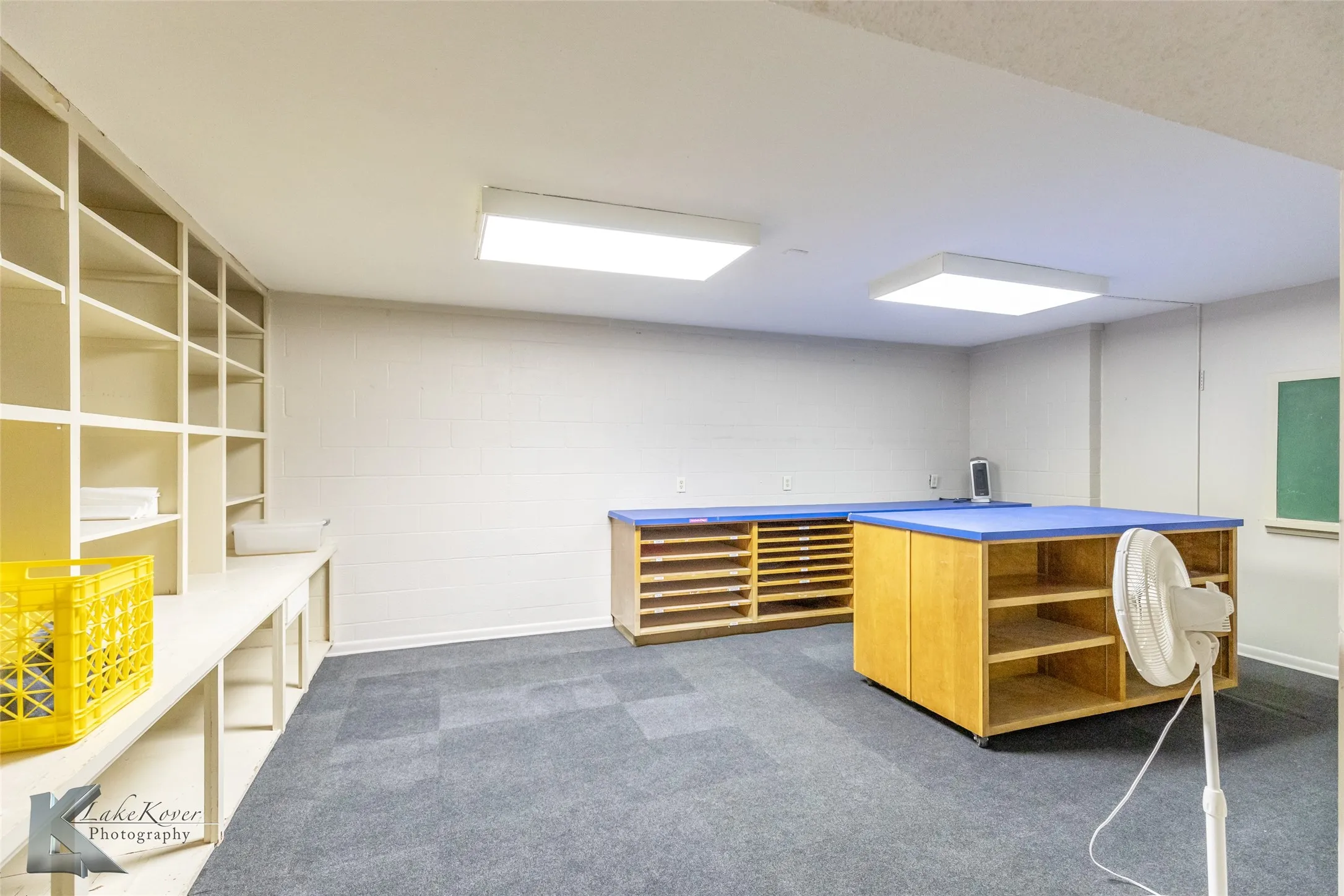 Unfurnished office with dark colored carpet