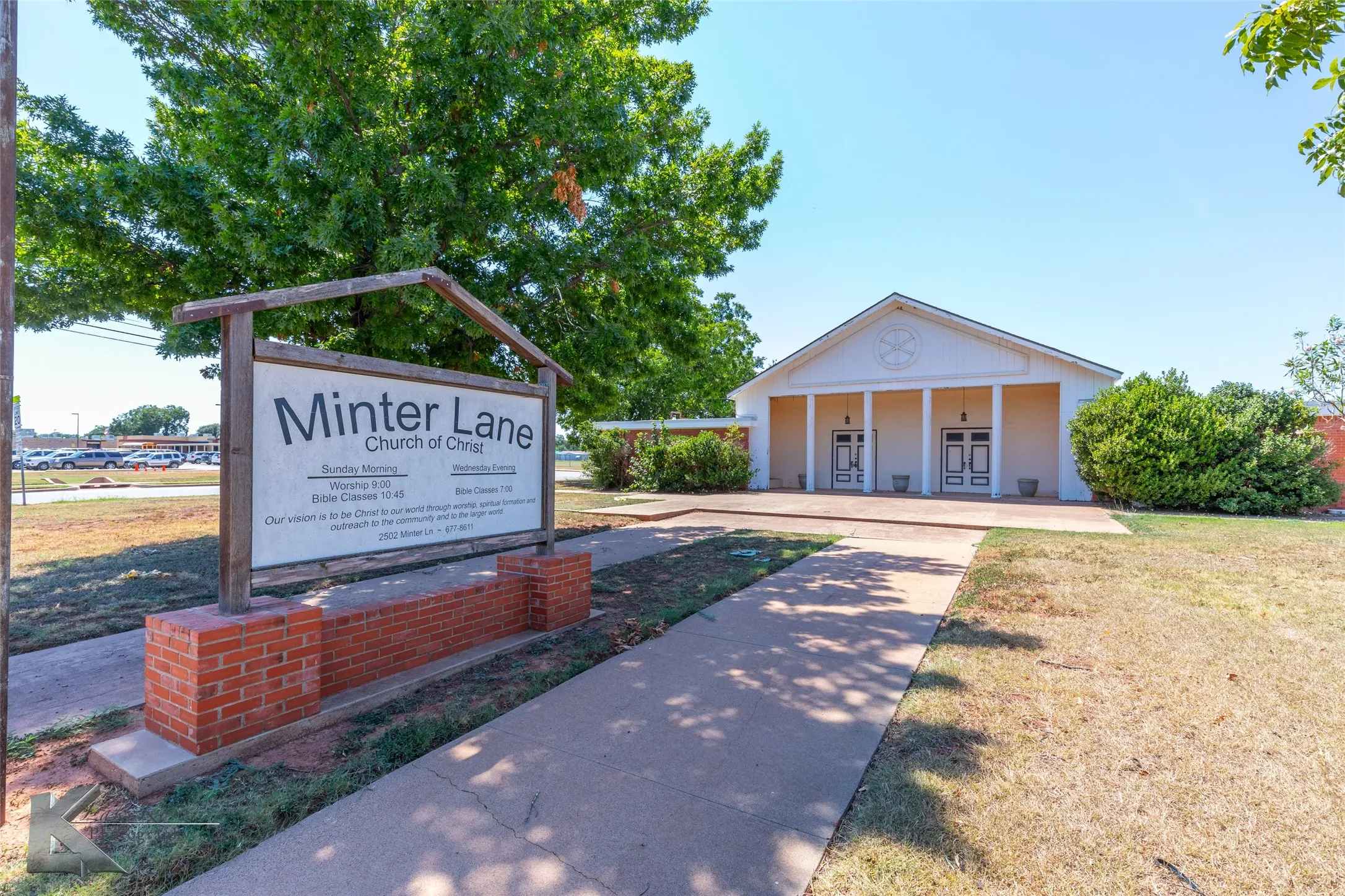 View of community with a lawn and covered porch