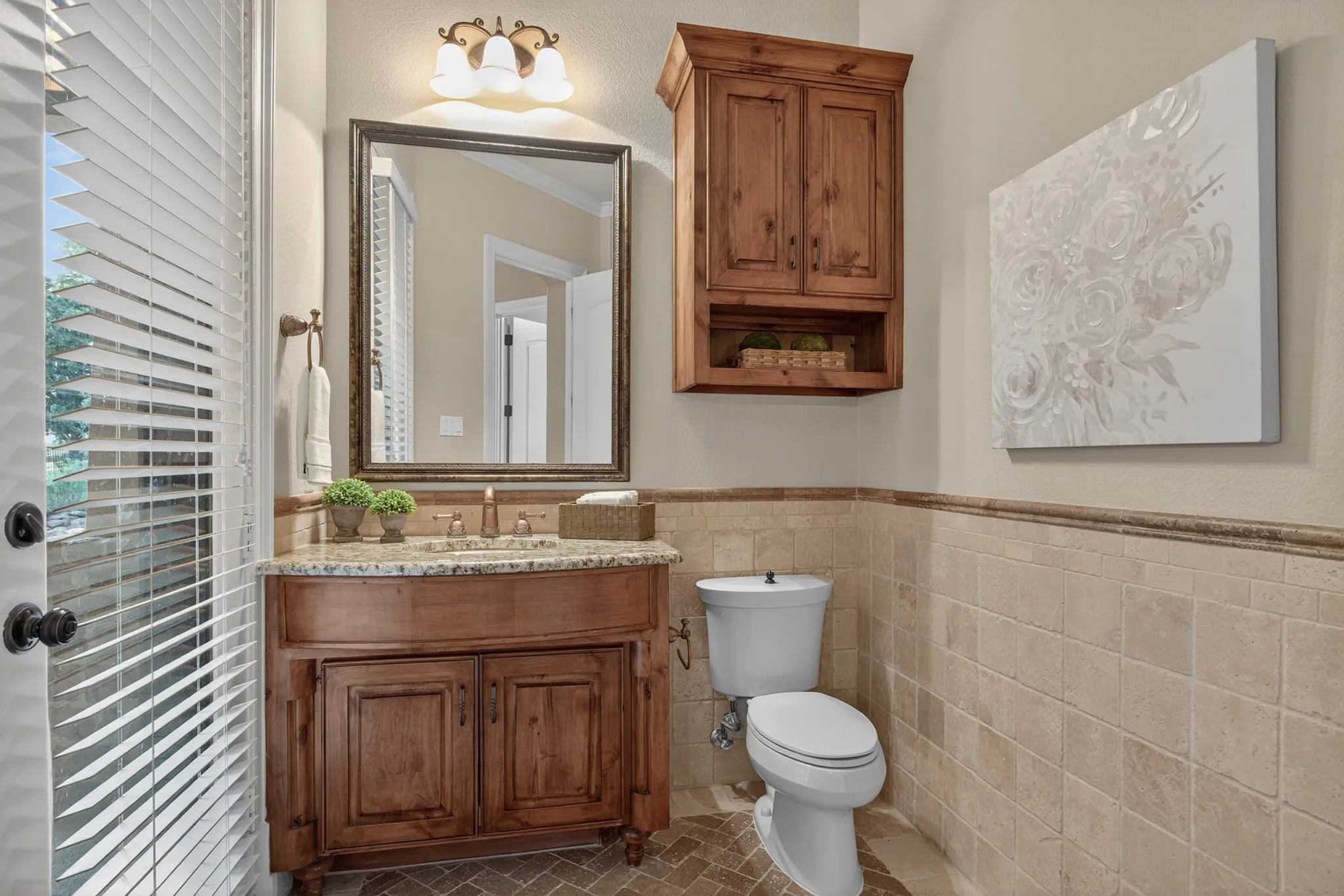 Full bathroom that exits to the pool and patio area and is near the kitchen and laundry room.