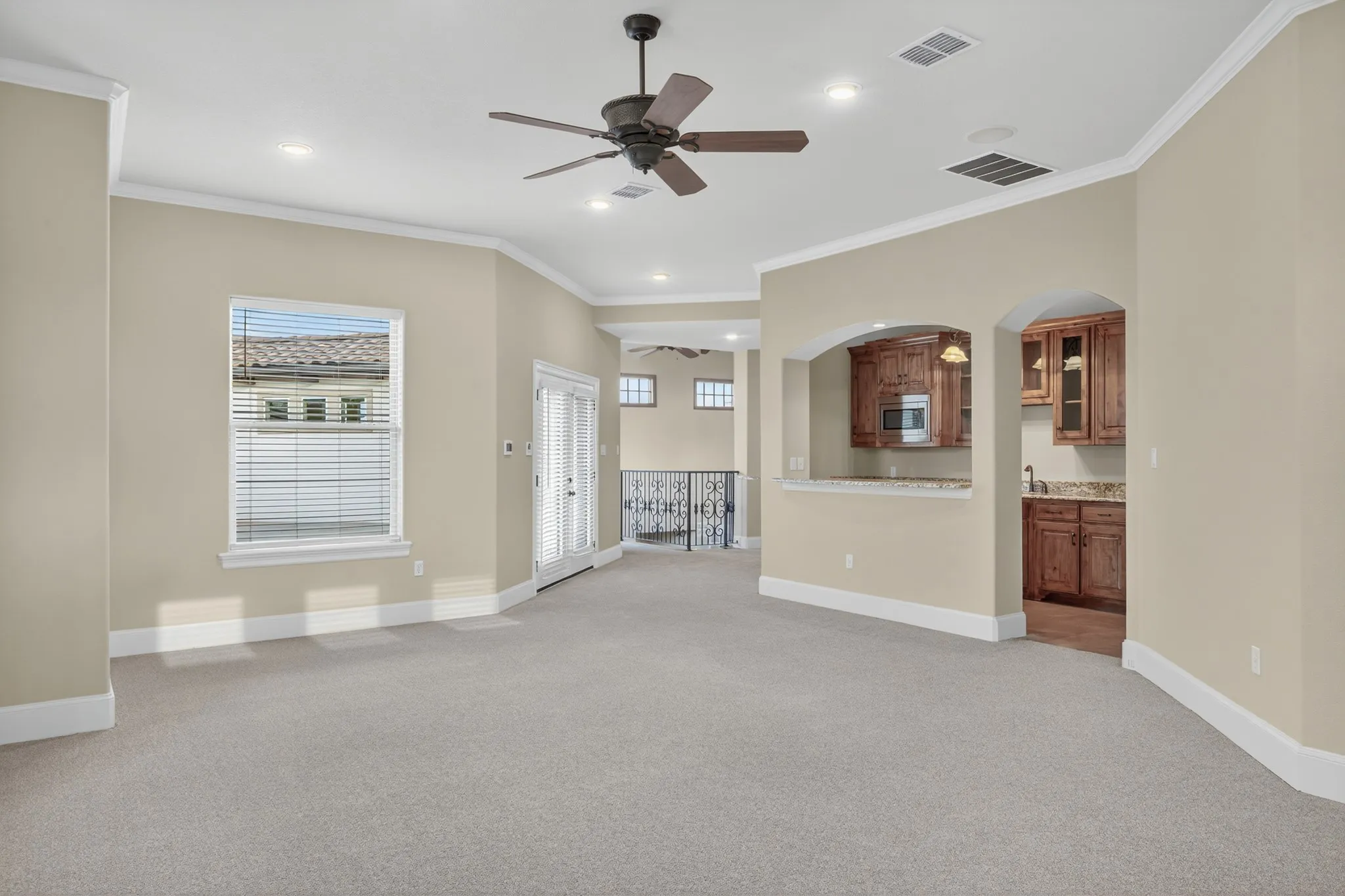 Step upstairs to find freshly updated bedrooms with new carpeting, while the expansive game room and second kitchen complete with wine fridge, ice maker, and serving bar invite evenings of laughter and connection.