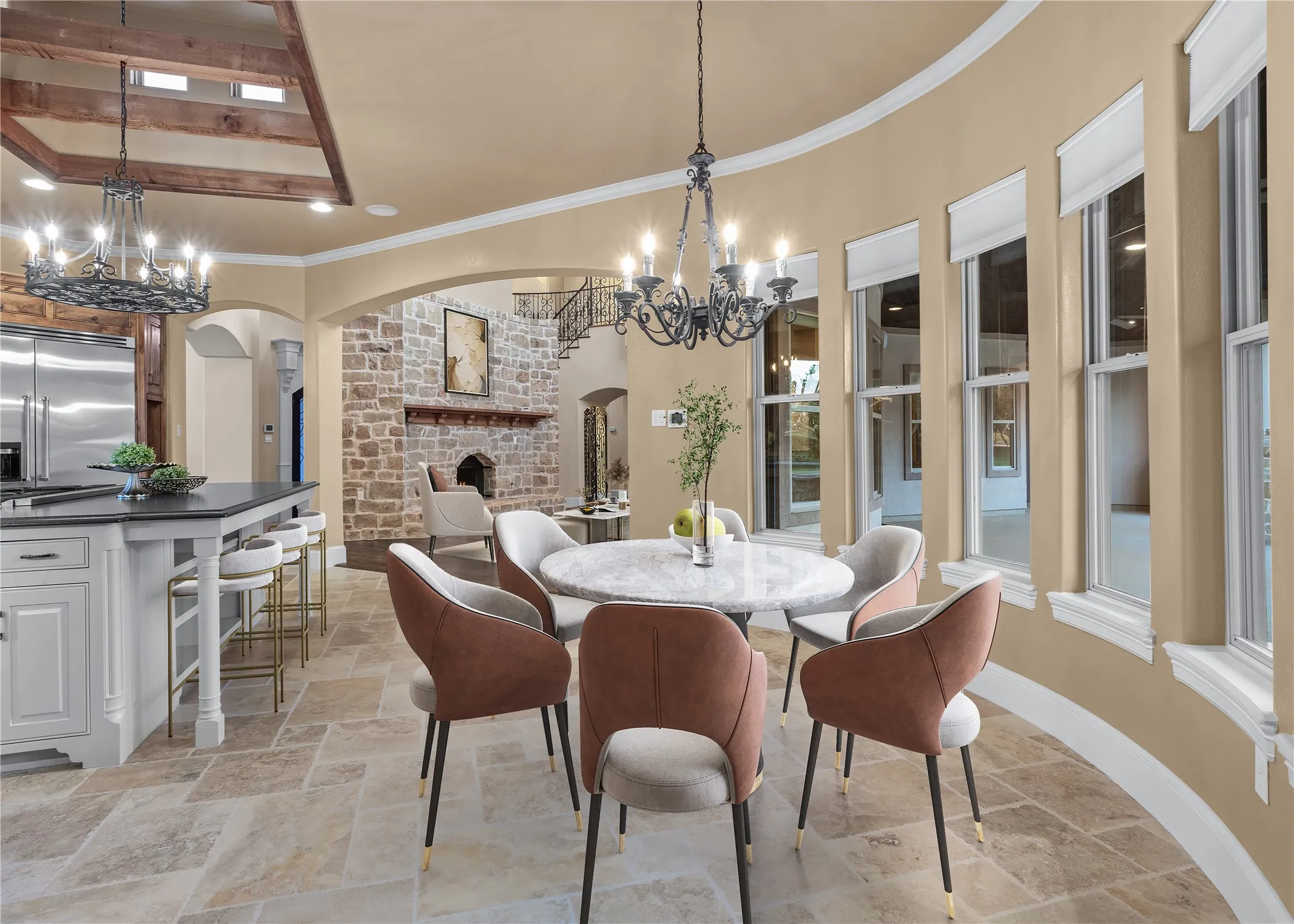 Enjoy the choice of two exceptional dining spaces, each thoughtfully designed for both elegance and comfort. The casual dining area offers a serene setting framed by a dramatic wall of windows, seamlessly blending indoor and outdoor living. Dine while taking in sweeping views of the glistening pool, tranquil spa, and the expansive, picturesque grounds beyond—an everyday experience that feels anything but ordinary. This photo has been virtually staged.