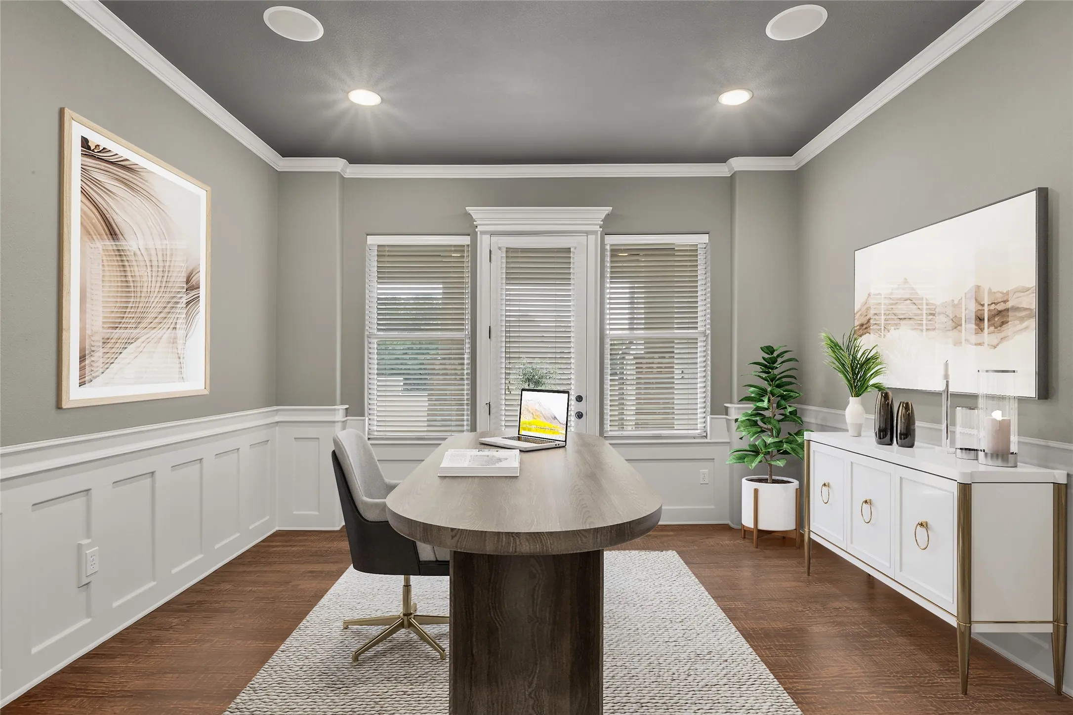 This executive office offers a perfect blend of elegance and functionality. Featuring hand-scraped wood floors that add rich texture and warmth, the room is adorned with classic wainscoting and sophisticated crown molding, enhancing its timeless appeal. A separate door provides direct access to the outdoors, inviting natural light and fresh air, while maintaining a private and professional atmosphere ideal for focused work or meetings. This space has been virtually staged.