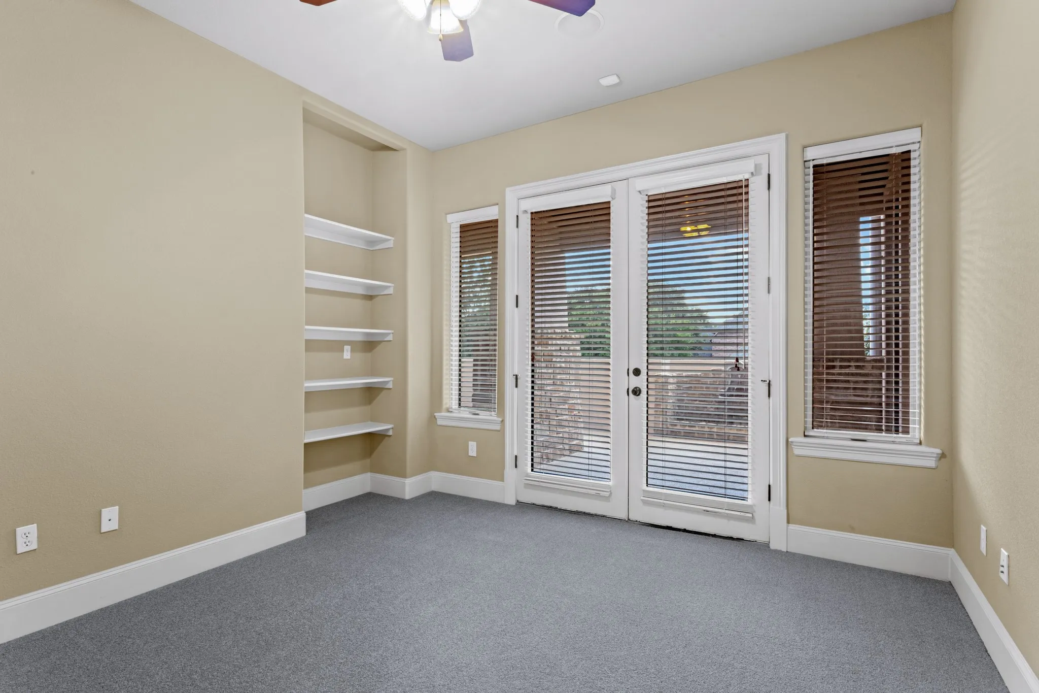 This bedroom downstairs has a private door to the side covered patio area with peaceful fountain. There is also a half bath nearby and a third full bath down this bedroom can utilize.