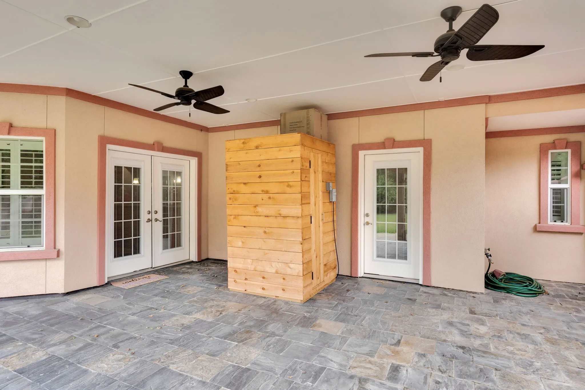 View of patio featuring a ceiling fan and french doors