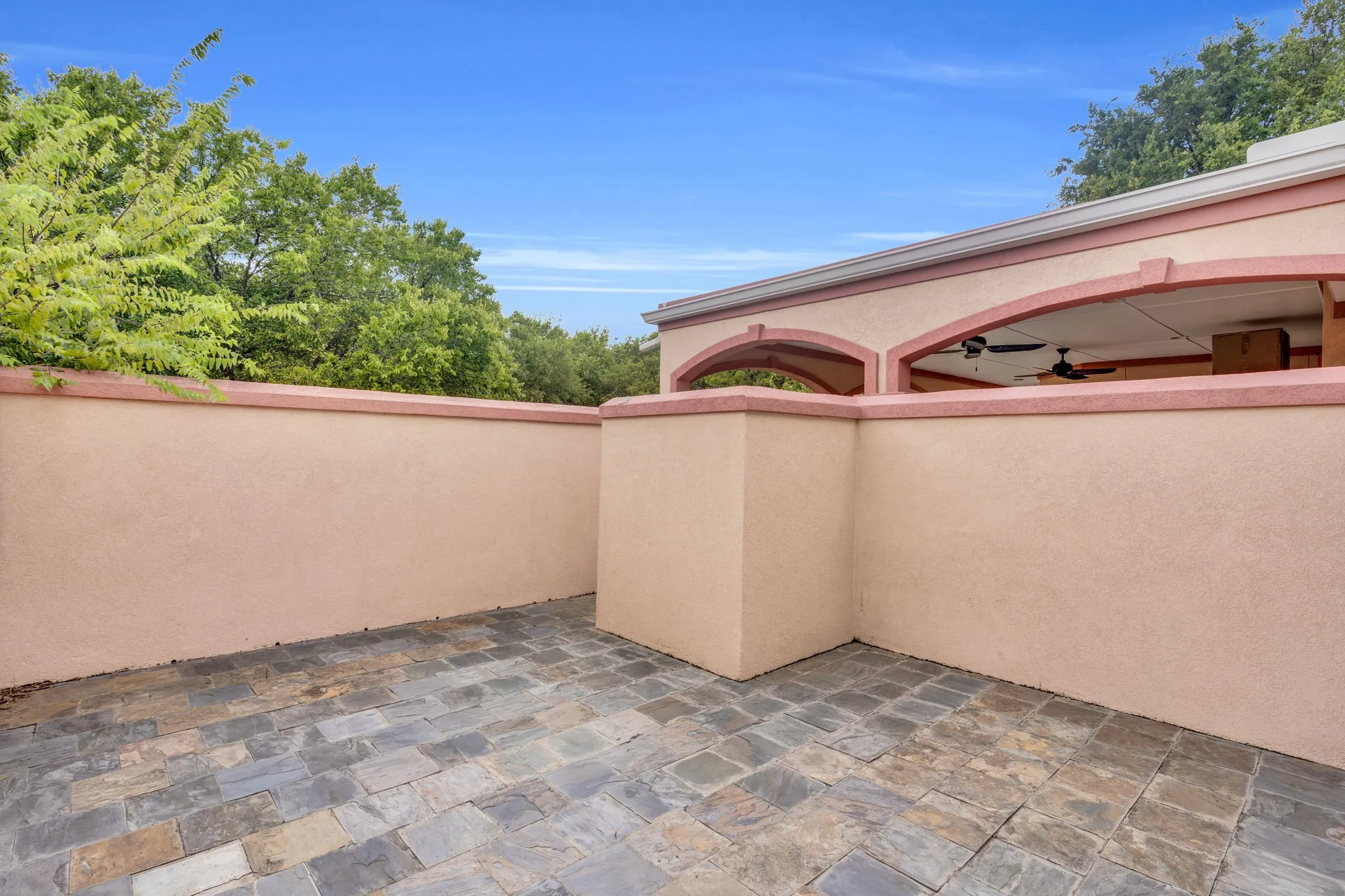 View of patio featuring ceiling fan