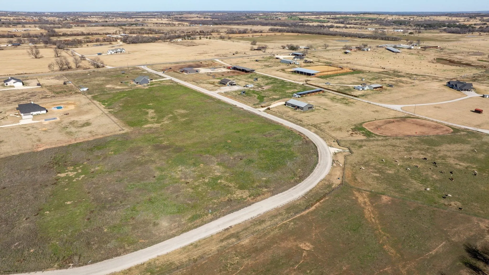 Aerial view of property and surrounding area featuring rural landscape