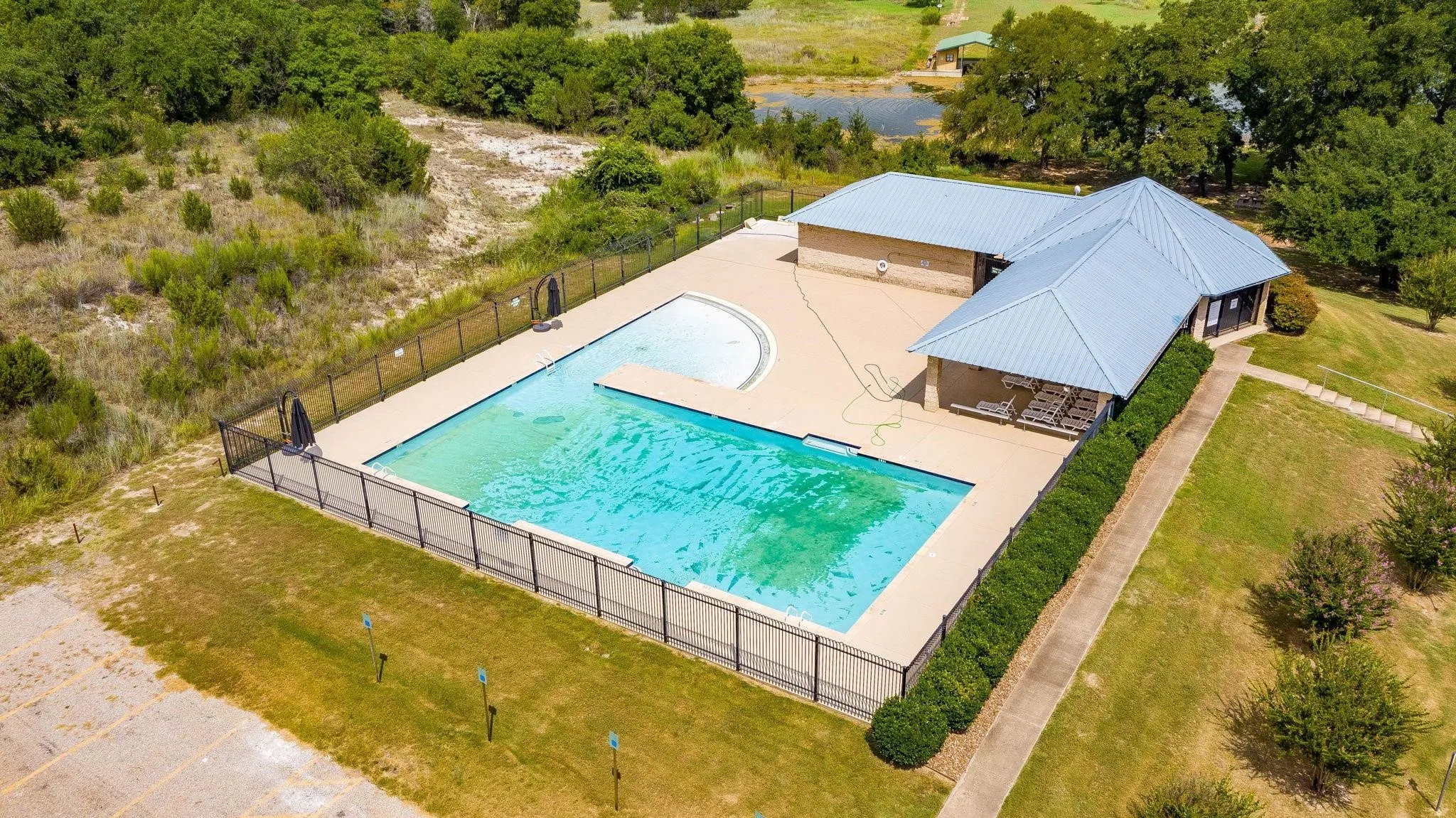 Community pool with a patio area