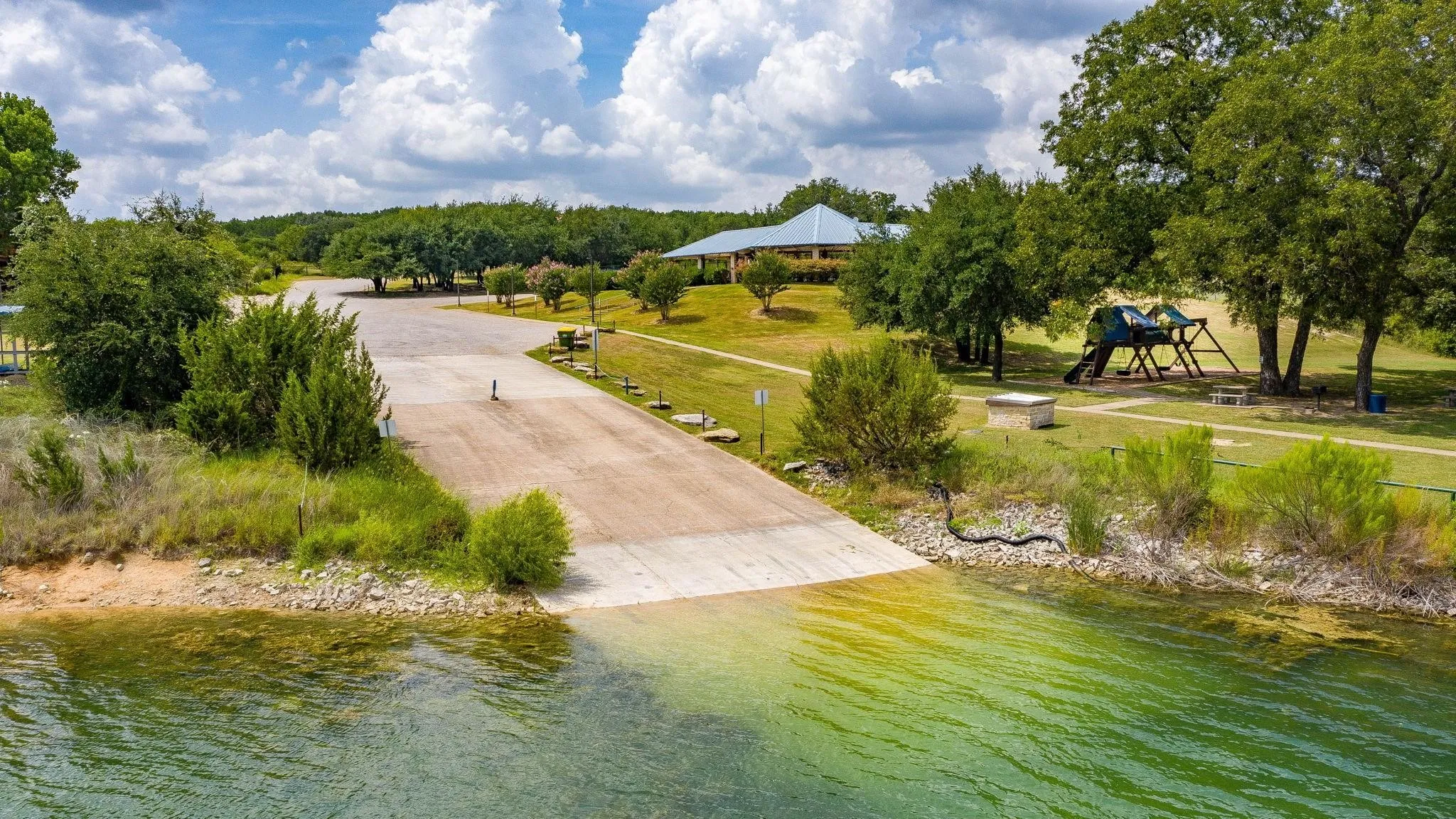 Bird's eye view of a large body of water and a tree filled landscape