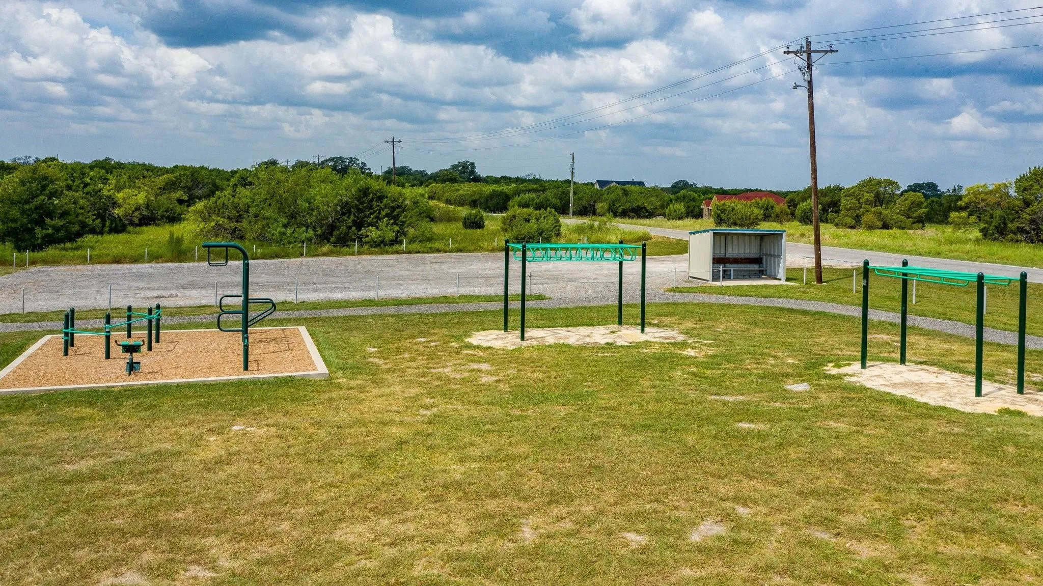 View of property's community with a lawn