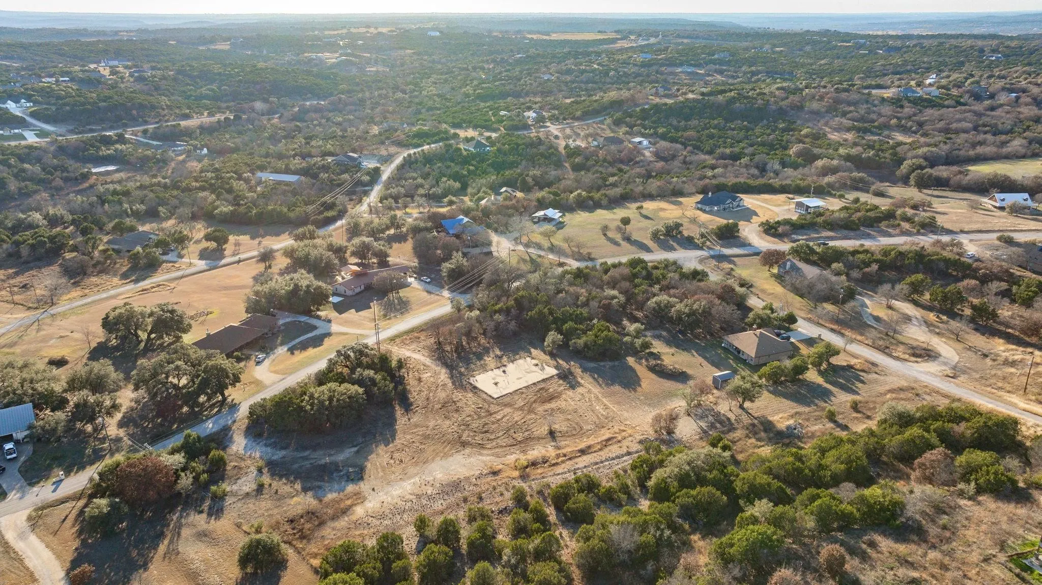 Aerial view of property and surrounding area featuring rural landscape